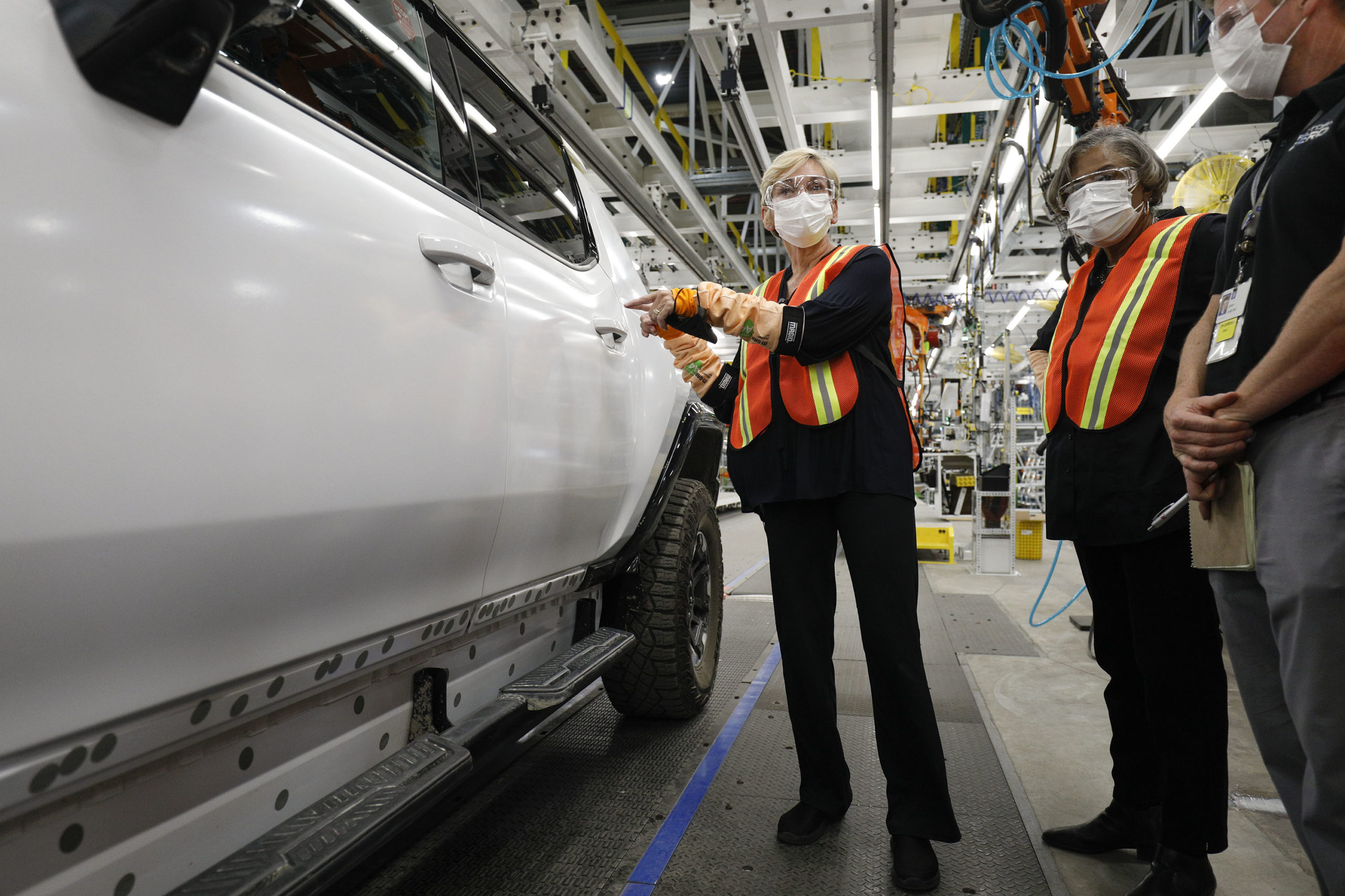 Secretary of Energy Jennifer Granholm examines a General Motors Hummer electric truck at GM Factory Zero on Aug. 5 in Detroit, Michigan. (Bill Pugliano/Getty Images)
