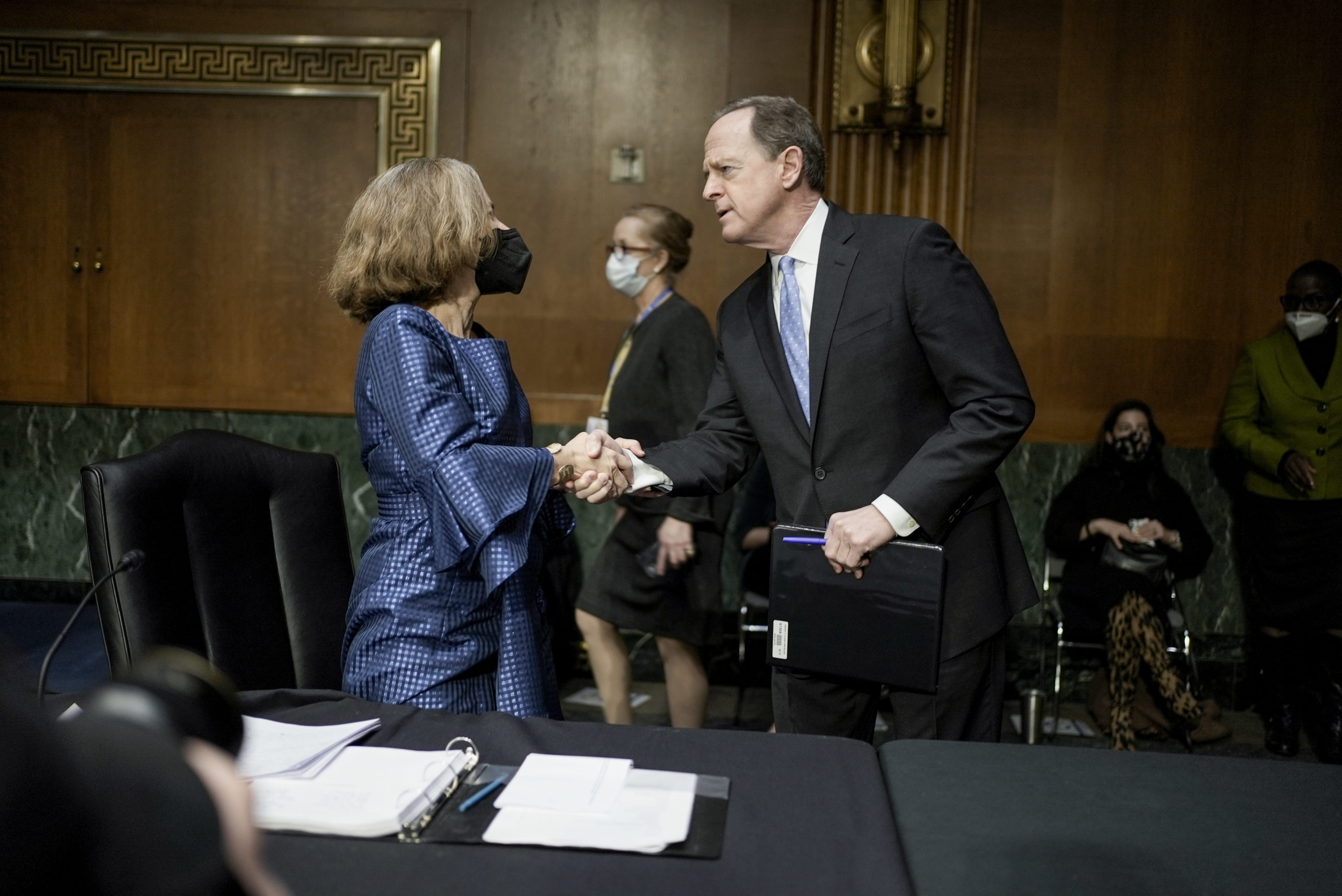 Sarah Bloom Raskin, President Joe Biden's nominee for vice chair of the Fed, greets Banking Committee Ranking Member Pat Toomey before her confirmation hearing Thursday. (Ken Cedeno/Pool/Getty Images)