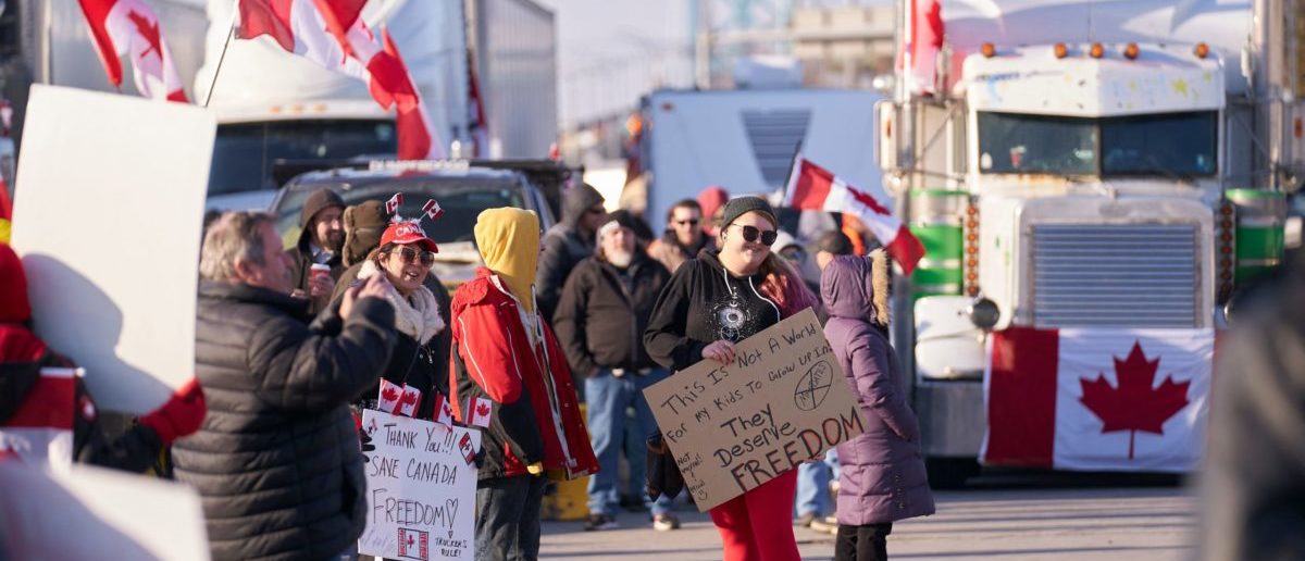Protestors against Covid-19 vaccine mandates block the roadway at the Ambassador Bridge border crossing in Windsor, Ontario, Canada, on February 9, 2022. - The protestors, who are in support of the Truckers Freedom Convoy in Ottawa, have blocked traffic in the Canada bound lanes of the bridge since Monday evening. Approximately $323 million worth of goods cross the Windsor-Detroit border each day at the Ambassador Bridge, making it North Americas busiest international border crossing. (Photo by Geoff Robins / AFP) (Photo by GEOFF ROBINS/AFP via Getty Images)