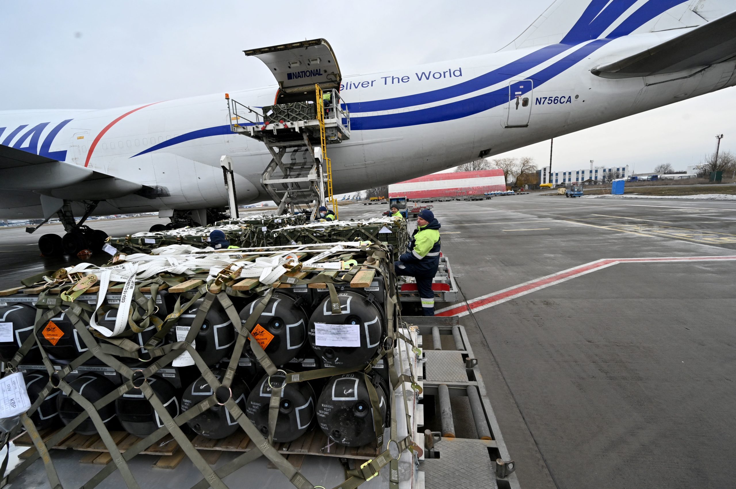 Employees unload a Boeing 747-412 plane with the FGM-148 Javelin, American man-portable anti-tank missile provided by US to Ukraine as part of US military support to Ukraine, at Kyiv's airport Boryspil on February 11,2022, amid the crisis linked with the threat of Russia's invasion. (Photo by Sergei SUPINSKY / AFP) (Photo by SERGEI SUPINSKY/AFP via Getty Images)