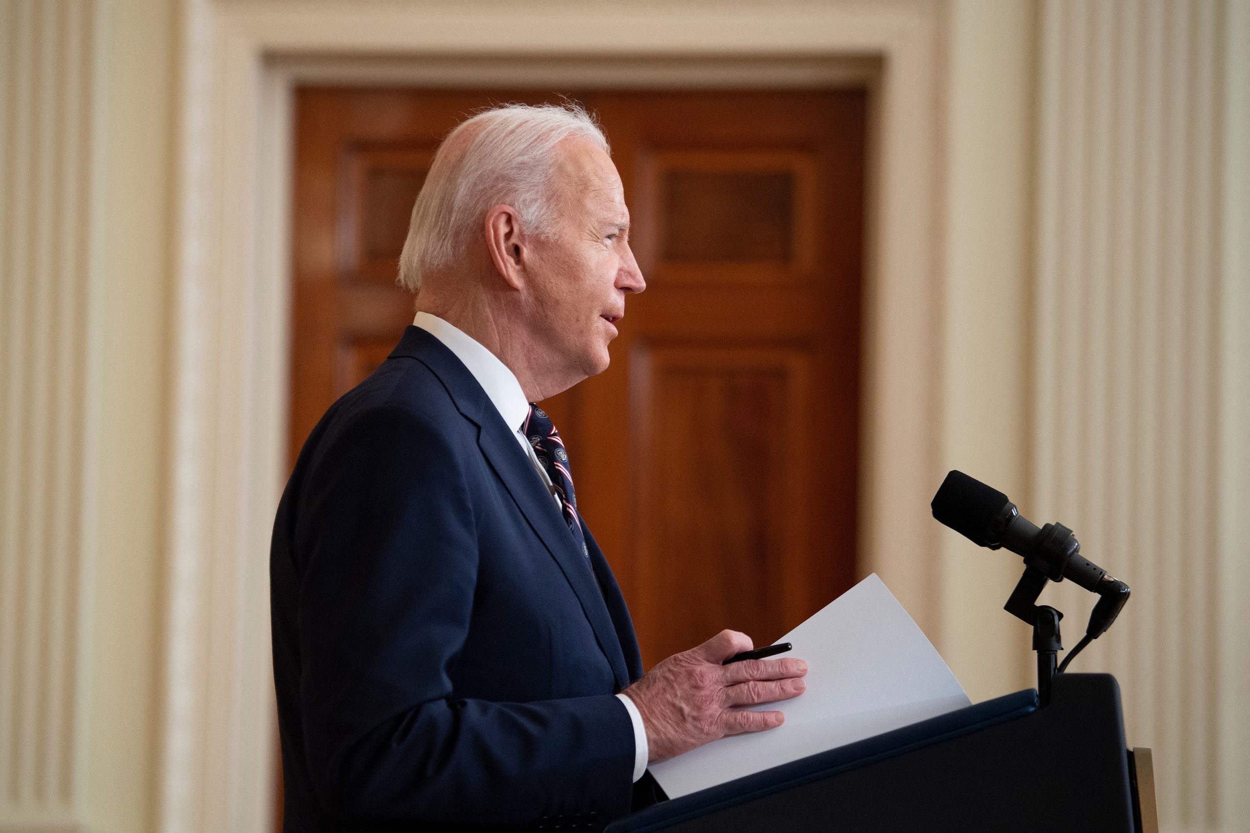President Joe Biden outlines the first round of sanctions his administration would impose in response to Russia's invasion of Ukraine at the White House on Tuesday. (Brendan Smialowski/AFP via Getty Images)