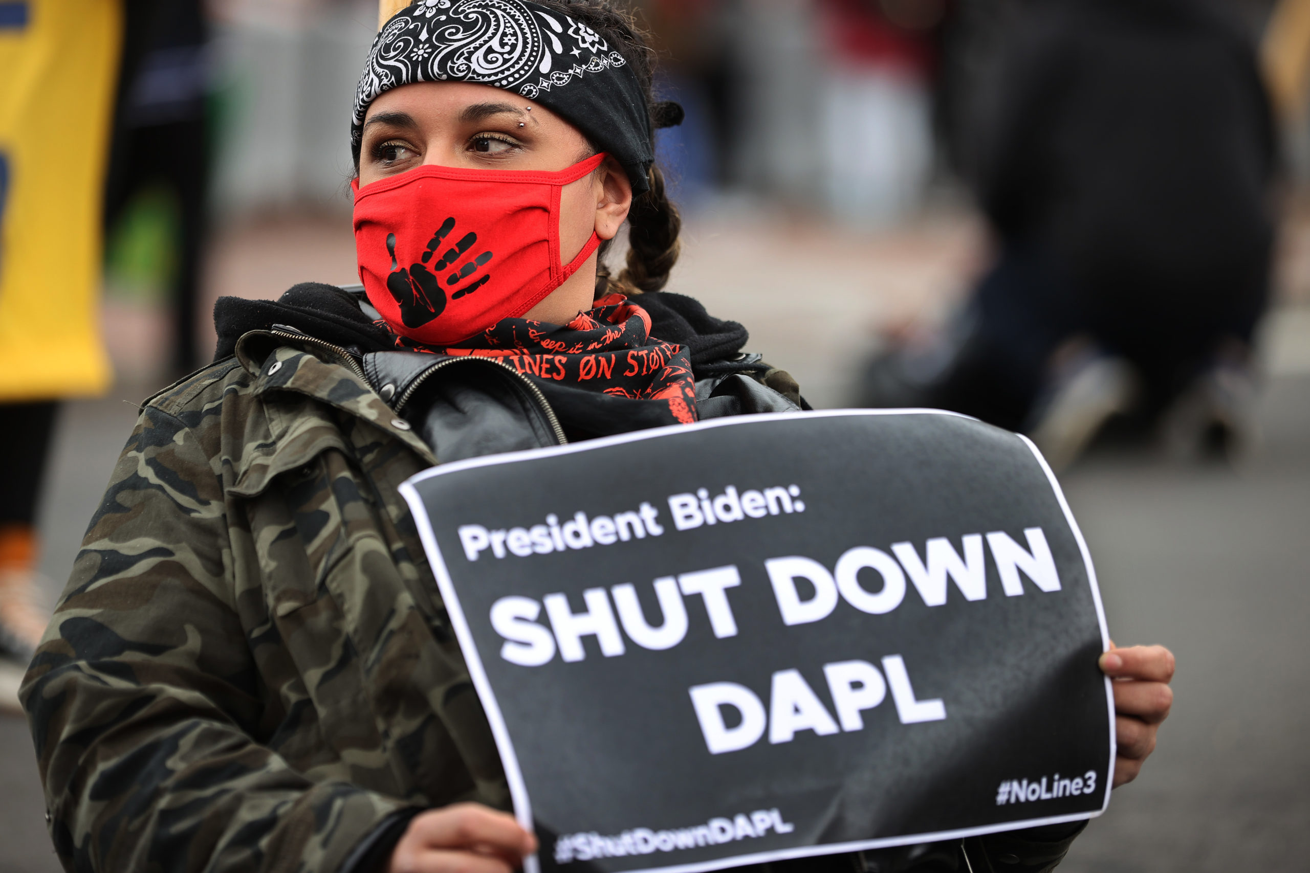 An indigenous environmental activist helps block traffic near the White House as part of a protest against the Dakota Access pipeline on April 1, 2021. (Chip Somodevilla/Getty Images)