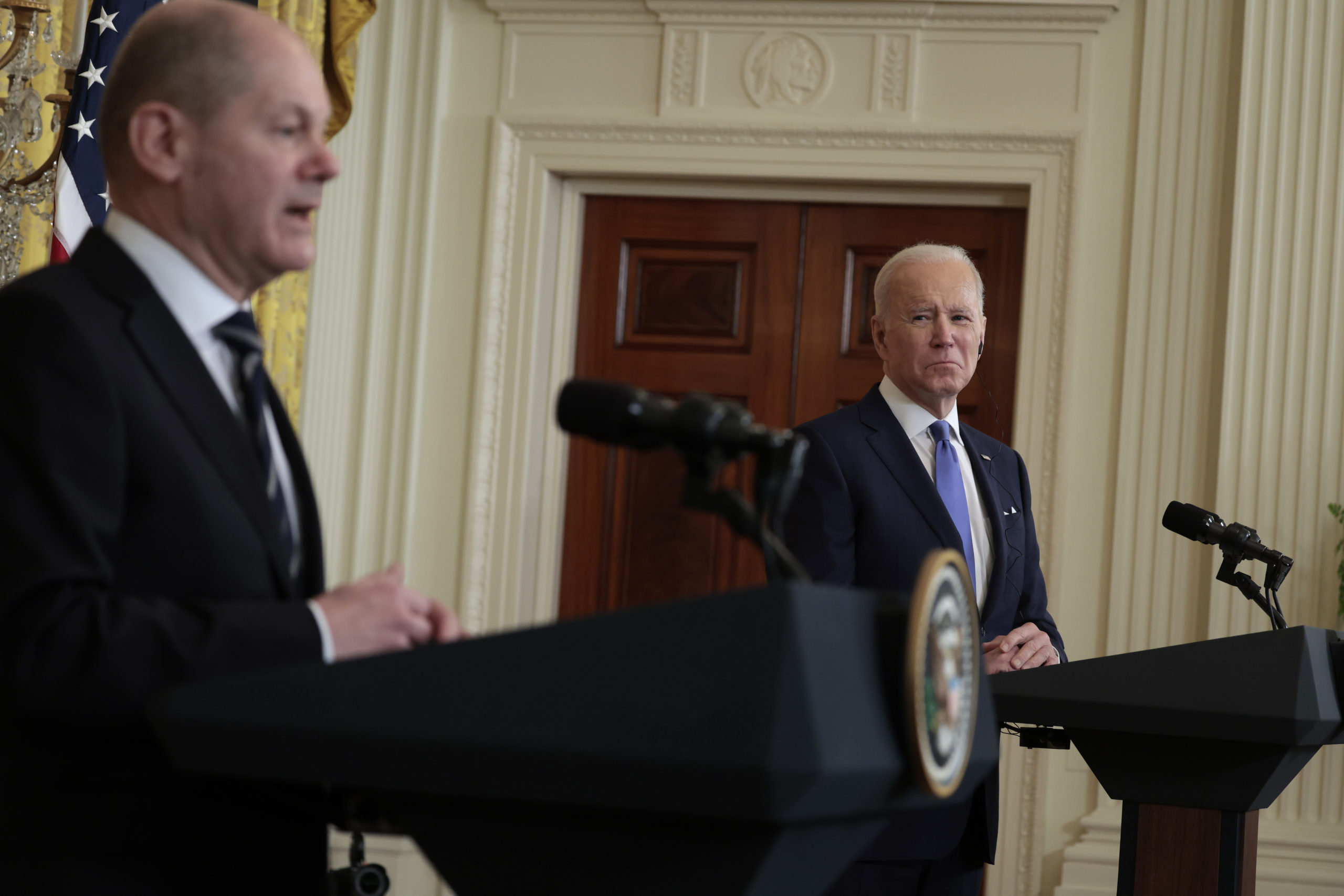 President Joe Biden listens as German Chancellor Olaf Scholz delivers remarks during a joint news conference at the White House on Feb. 7. (Anna Moneymaker/Getty Images)
