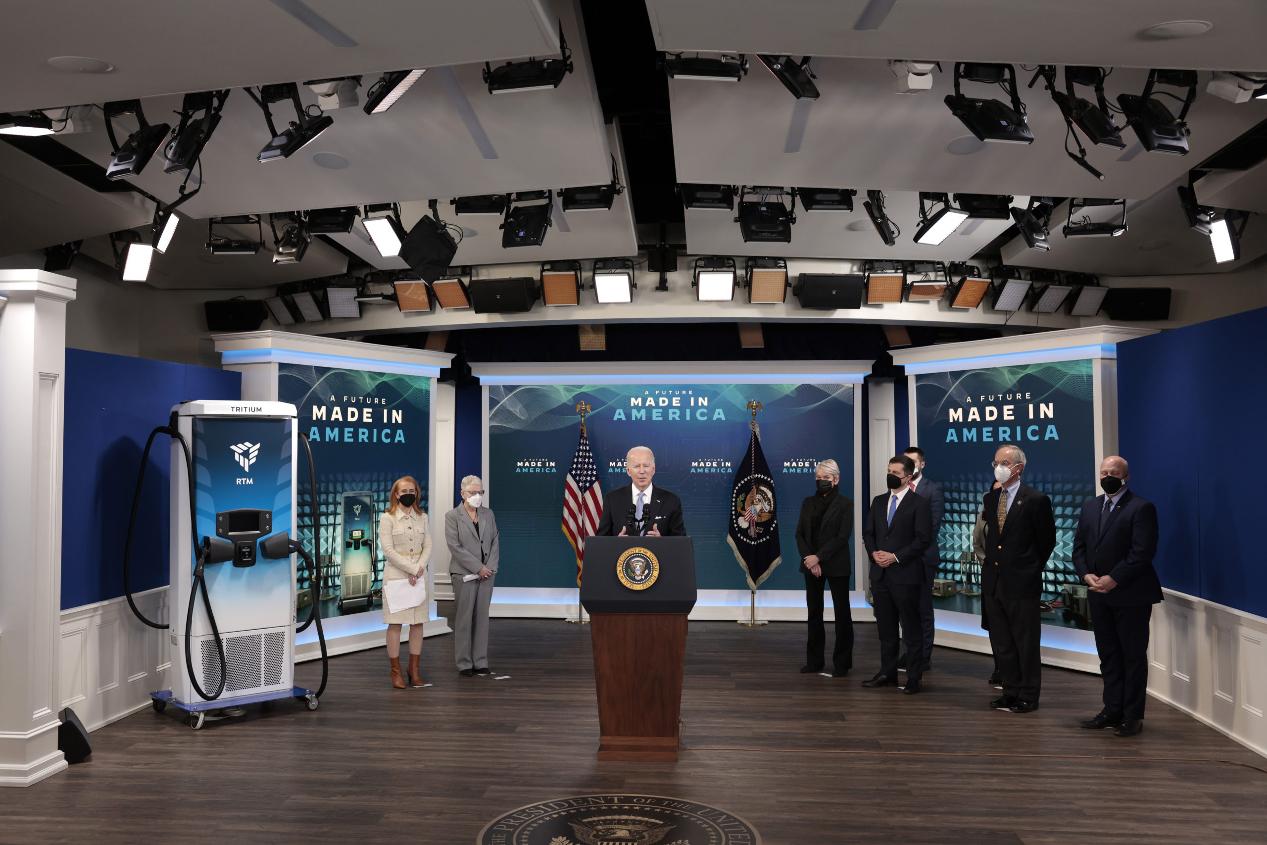 President Joe Biden delivers remarks on his administration's efforts to increase manufacturing alongside members of his cabinet and Tritium CEO Jane Cooper at the White House on Tuesday. (Anna Moneymaker/Getty Images)