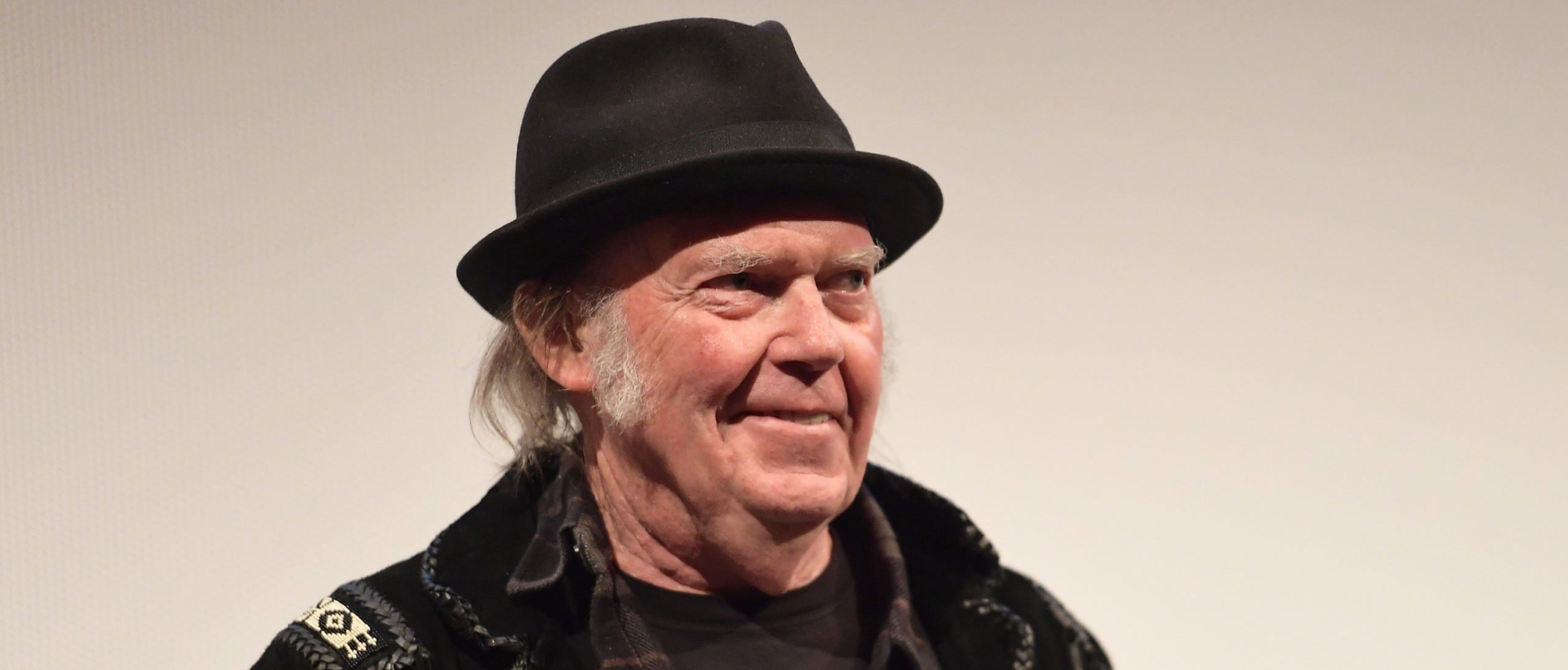 Neil Young Says Canceling Joe Rogan Isn’t Enough, Calls For Spotify Employees To Quit Their Jobs