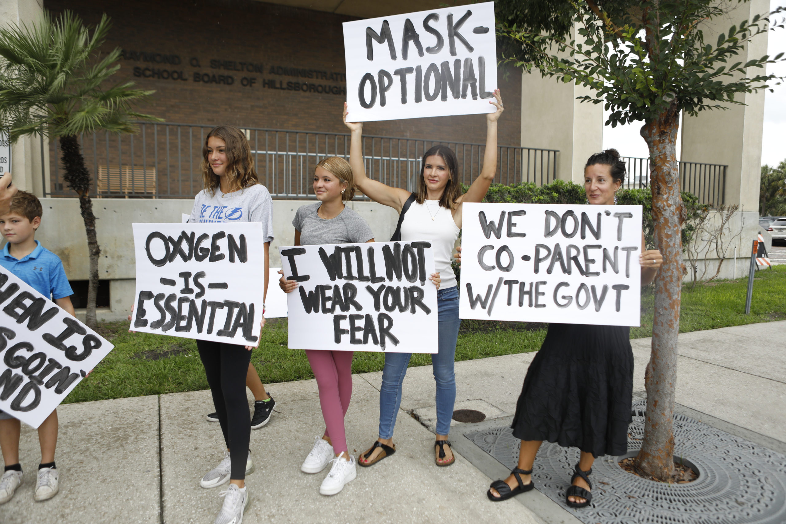  Families protest any potential mask mandates before the Hillsborough County Schools Board meeting held at the district office on July 27, 2021 in Tampa, Florida. The Centers for Disease Control and Prevention recommended those who are vaccinated should wear masks indoors including students returning to school. (Photo by Octavio Jones/Getty Images)
