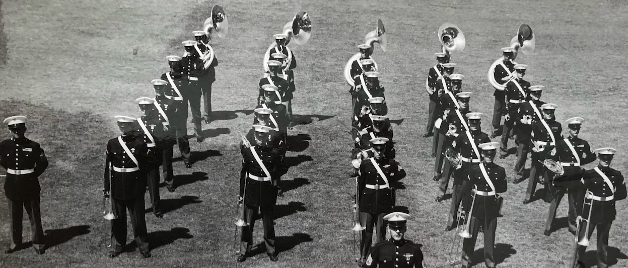 Standing at attention in the far right row behind a Marine with a french horn, Sgt. Garcia holds his trumpet in this photo taken on Naval Station Treasure Island. [Photo courtesy of Sgt. Gil Garcia]