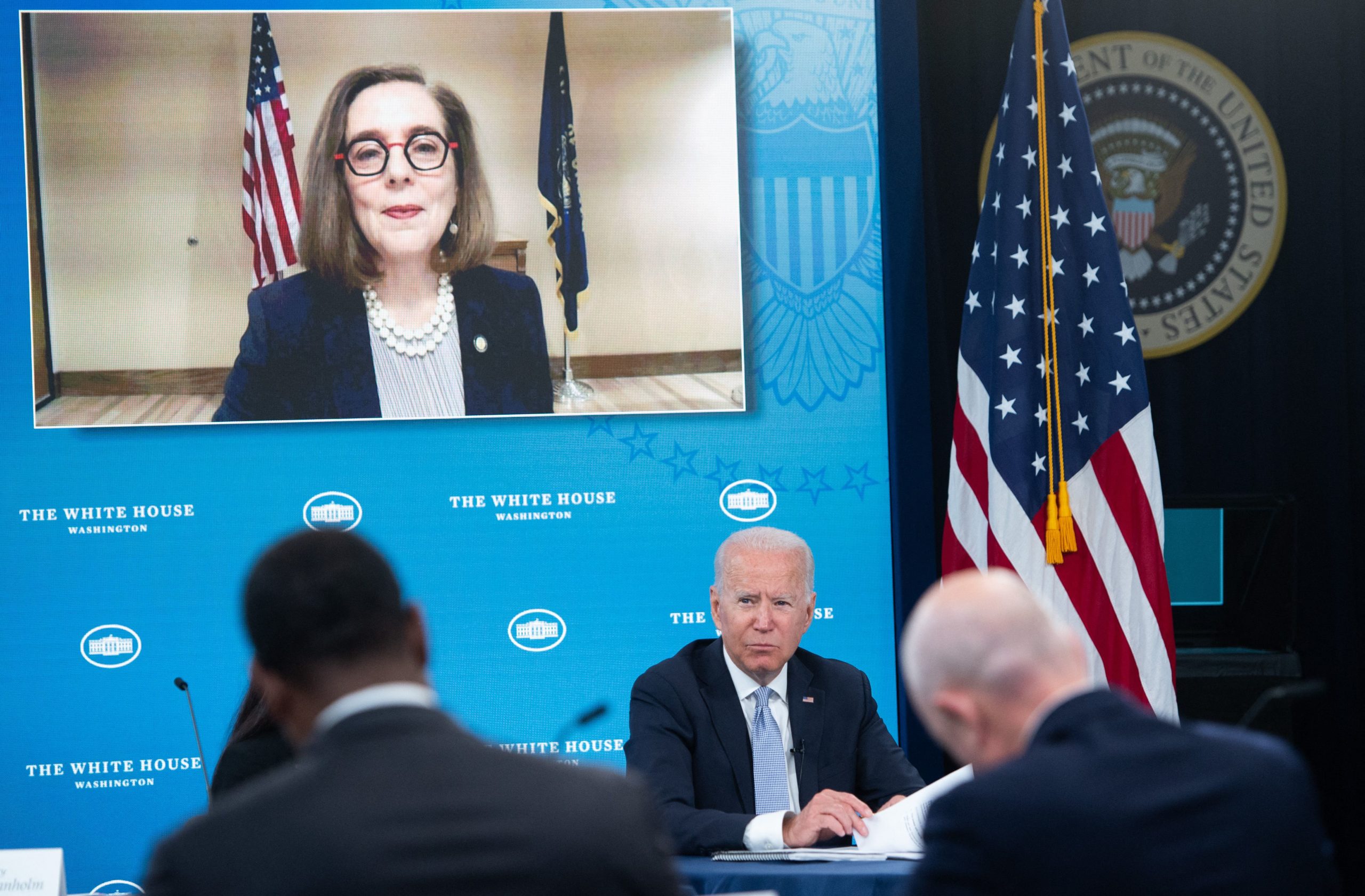 President Joe Biden holds a briefing with cabinet members and government officials as Oregon Gov. Kate Brown looks on June 30, 2021. (Saul Loeb/AFP via Getty Images)