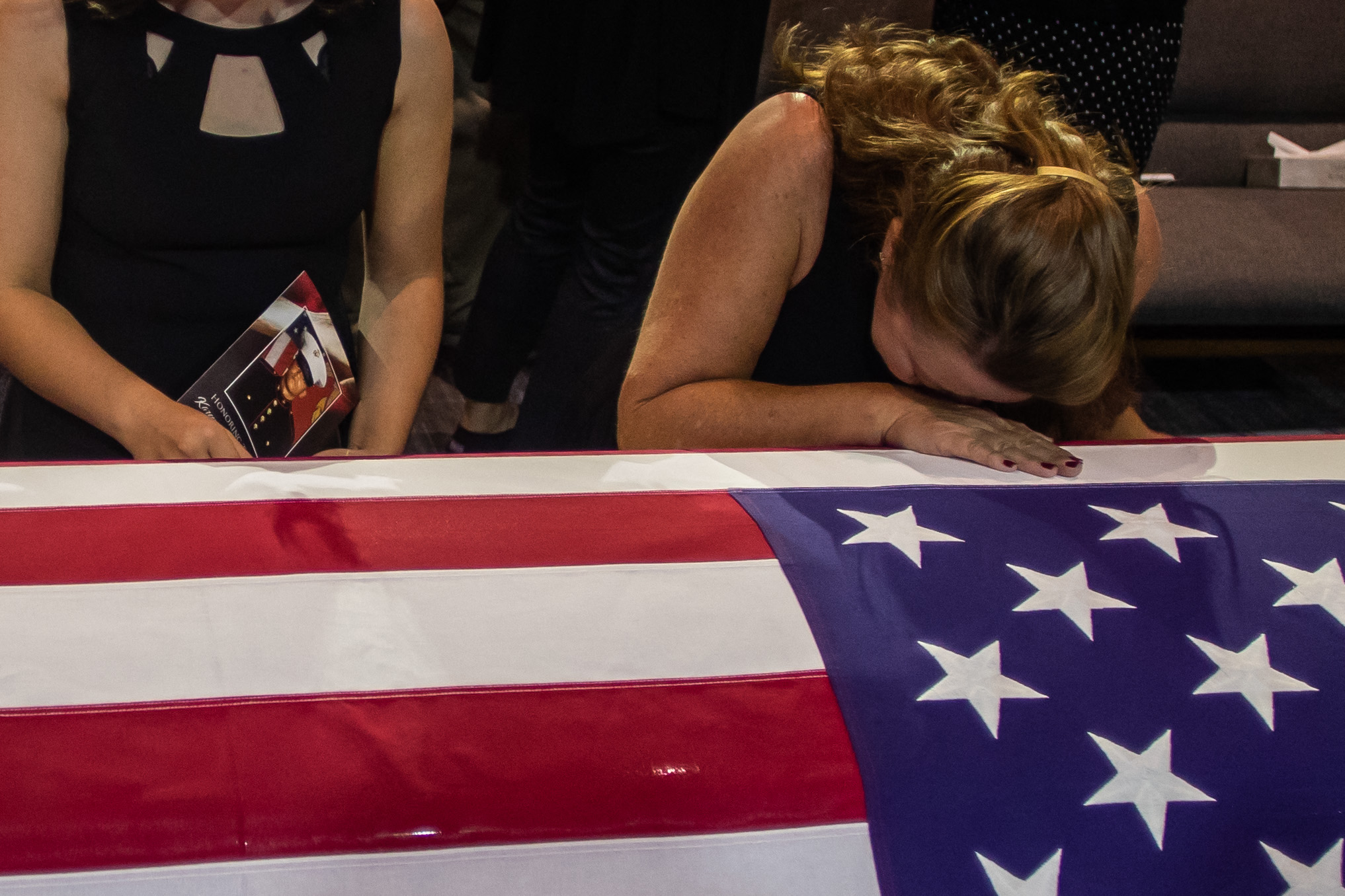 People pay their respects during the funeral of Marine Lance Cpt. Kareem Grant Nikoui at the Harvest Christian Fellowship on September 18, 2021 in Riverside, California. - Nikoui was one of 13 US service members killed in the suicide blast in Kabul during the evacuation of US citizens, and Afghan civilians on August 26. (Photo by Apu GOMES / AFP) (Photo by APU GOMES/AFP via Getty Images)