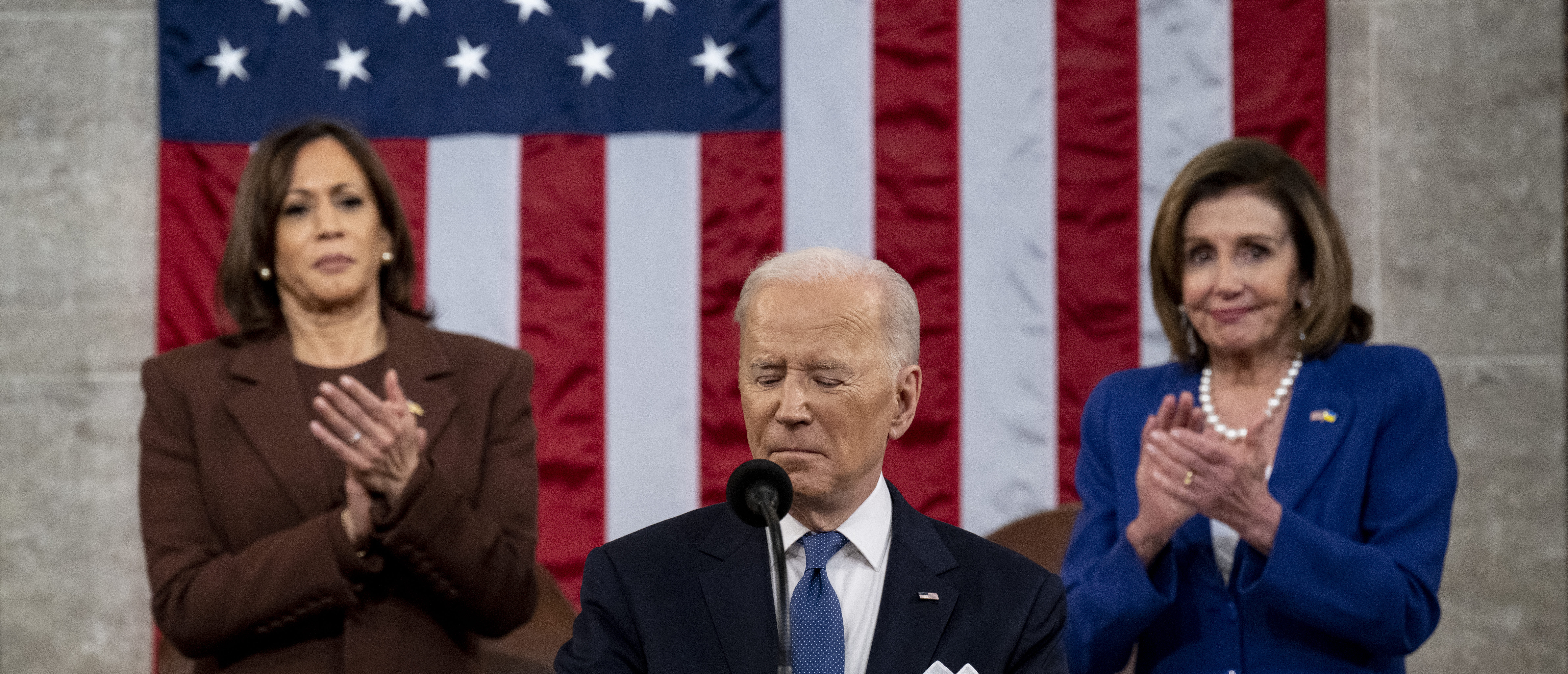WASHINGTON, DC - MARCH 01: US President Joe Biden delivers the State of the Union address as U.S. Vice President Kamala Harris (L) and House Speaker Nancy Pelosi (D-CA) applaud during a joint session of Congress in the U.S. Capitol House Chamber on March 1, (Photo by Saul Loeb - Pool/Getty Images)