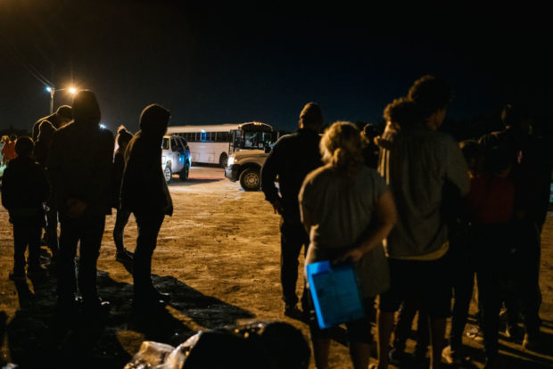LA JOYA, TEXAS - NOVEMBER 17: Migrant families stand together while waiting to board a border patrol bus after crossing the Rio Grande into the U.S. on November 17, 2021 in La Joya, Texas. The number of migrants taken into U.S. custody along the southern border decreased for a third consecutive month in October. U.S. Customs and Border Protection (CBP) recorded more than 164,000 migrant apprehensions in October. Approximately 55% of migrants encountered were expelled back to Mexico, or their homelands. U.S. President Joe Biden is set to have a meeting this Thursday with Mexican President Andrés Manuel López Obrador, and Canadian Prime Minister Justin Trudeau where they will discuss the coronavirus pandemic, climate change, immigration and economic growth. (Photo by Brandon Bell/Getty Images)