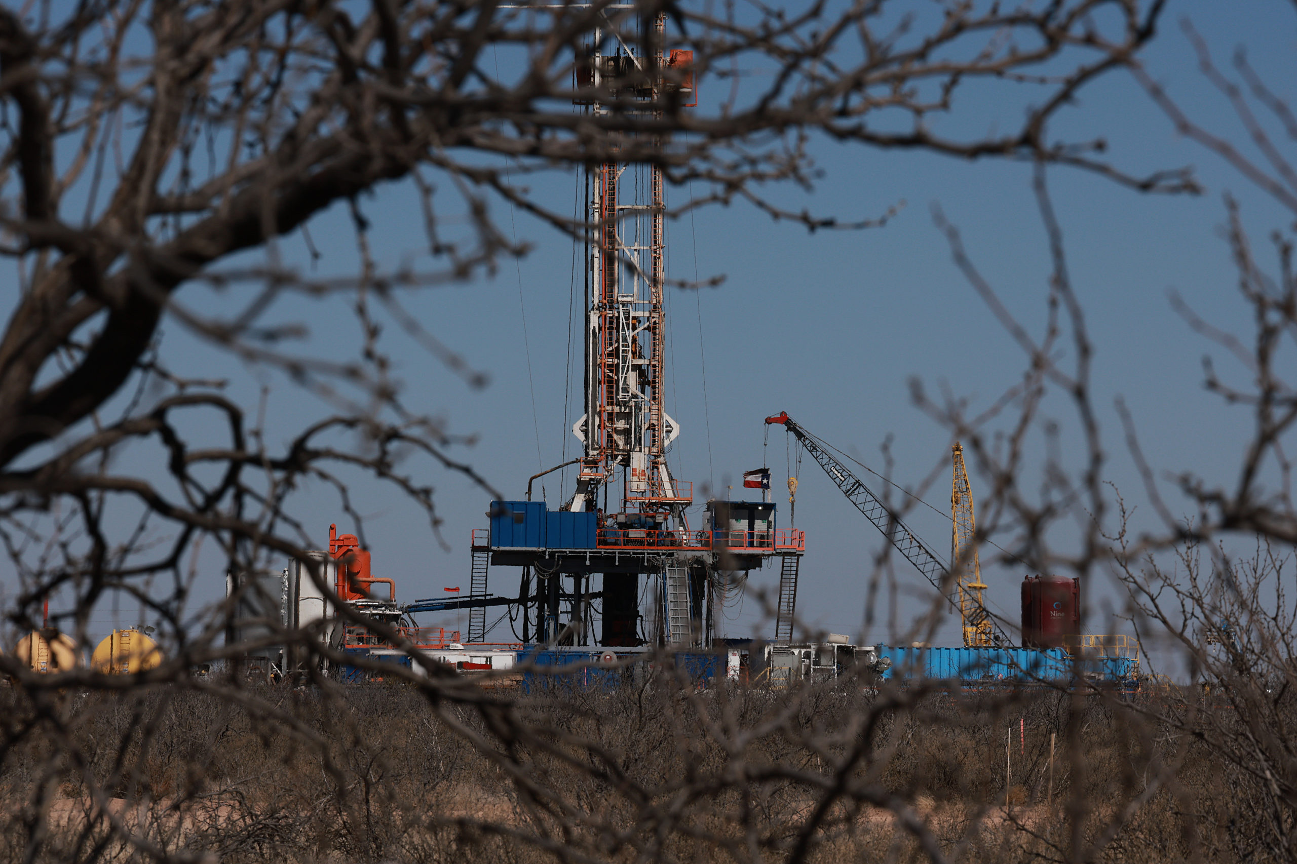 An oil drilling rig works in the Permian Basin oil field on March 13 in Midland, Texas. (Joe Raedle/Getty Images)