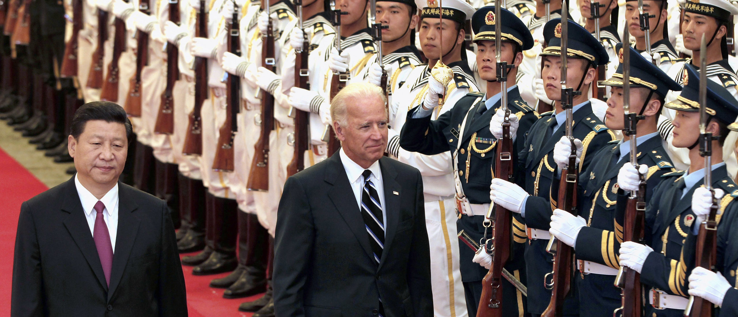 Chinese Vice President Xi Jinping (L) and U.S. Vice President Joe Biden view an honor guard during a welcoming ceremony inside the Great Hall of the People in Beijing August 18, 2011. Biden will visit China, Mongolia and Japan from August 17-25. (REUTERS/Lintao Zhang/Pool)