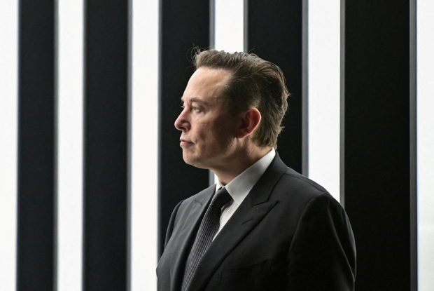 FILE PHOTO: Elon Musk attends the opening ceremony of the new Tesla Gigafactory for electric cars in Gruenheide, Germany, March 22, 2022. Patrick Pleul/Pool via REUTERS/File Photo