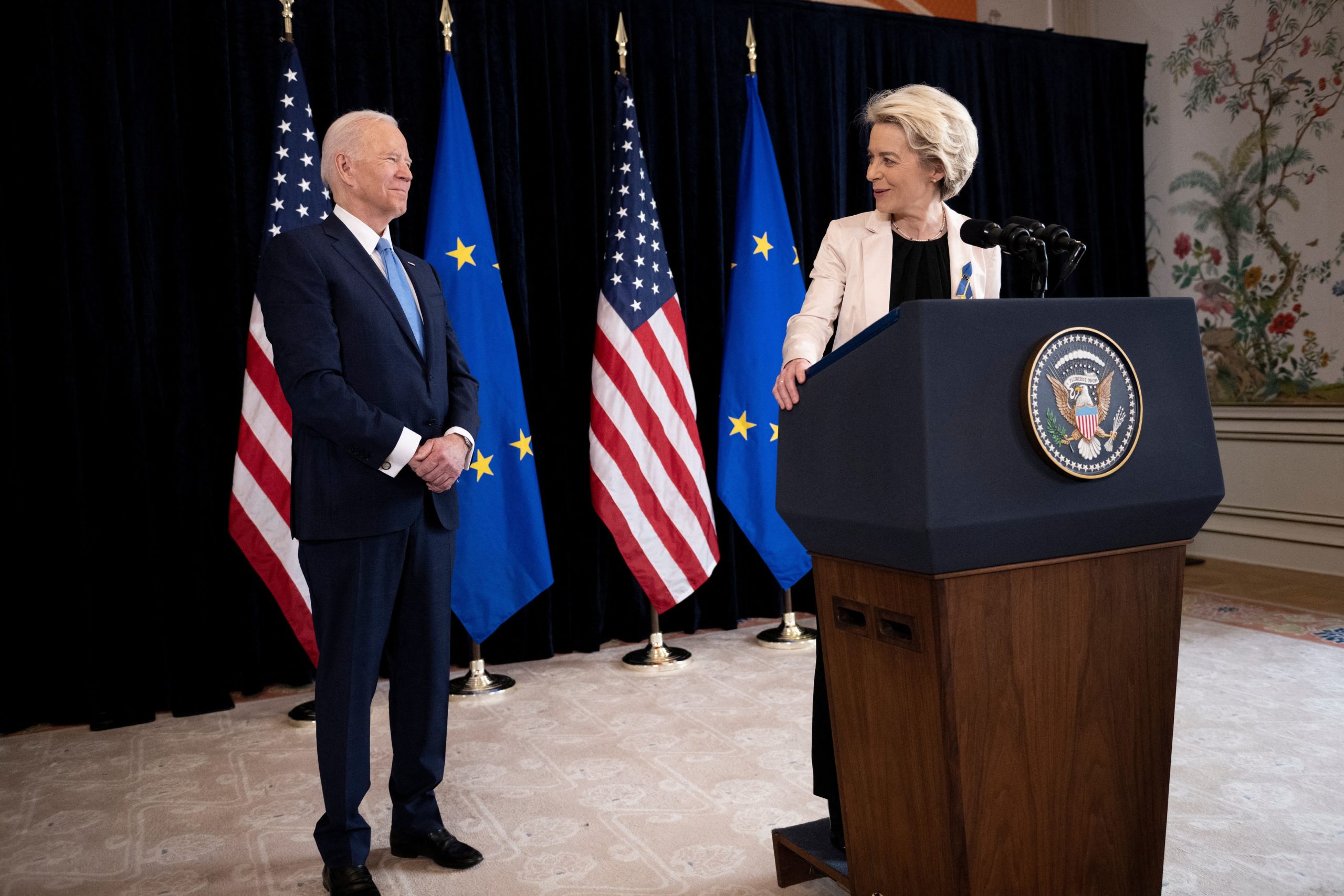 President Joe Biden listens while European Commission President Ursula von der Leyen makes a statement on March 25. (Brendan Smialowski/AFP via Getty Images)