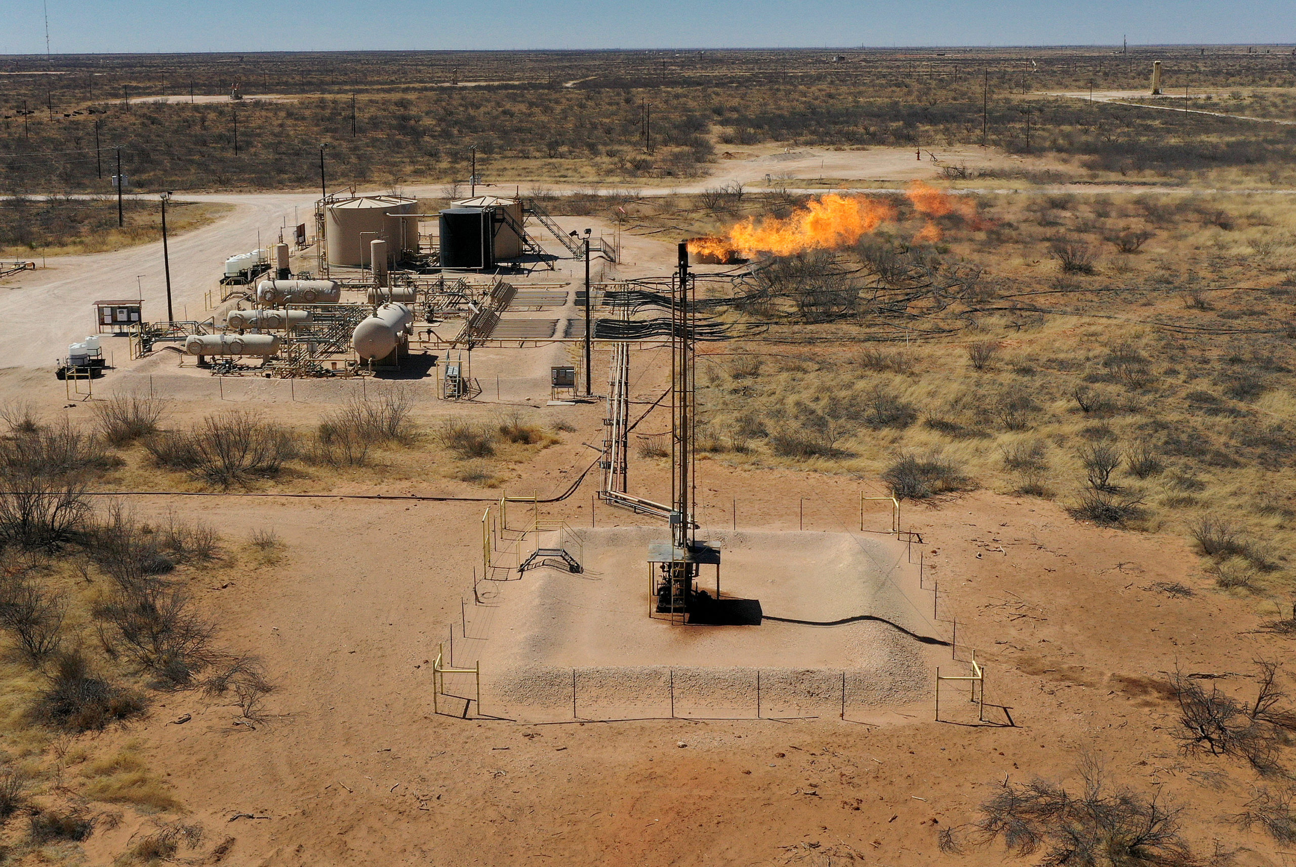 Natural gas is flared off in the Permian Basin oil field on March 12 in Andrews, Texas. (Joe Raedle/Getty Images)