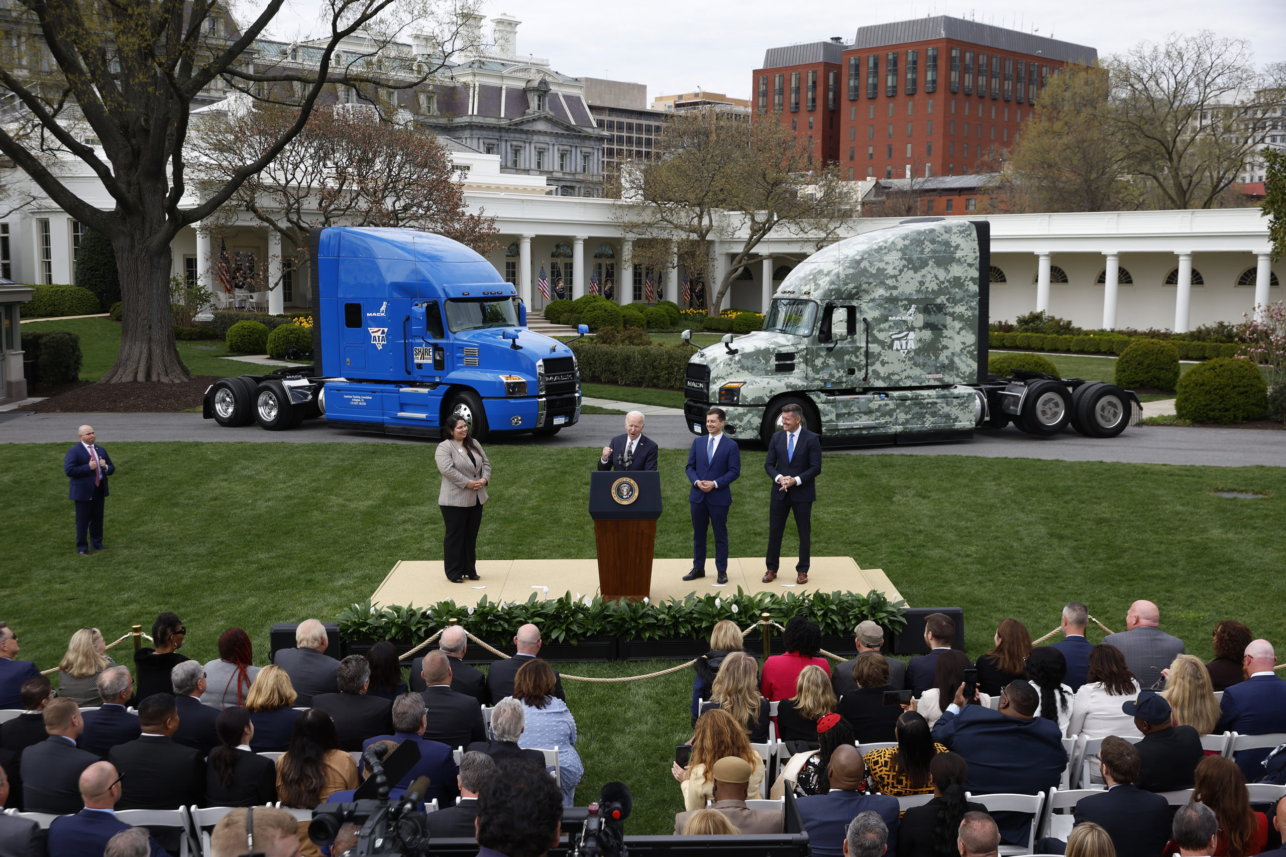 President Joe Biden (C) delivers remarks on his 'Trucking Action Plan' with apprentice truck driver Maria Rodriguez, Transportation Secretary Pete Buttigieg and Veterans Trucking Task Force Chair Patrick Murphy on the South Lawn of the White House on April 04, 2022 in Washington, DC. (Photo by Chip Somodevilla/Getty Images)