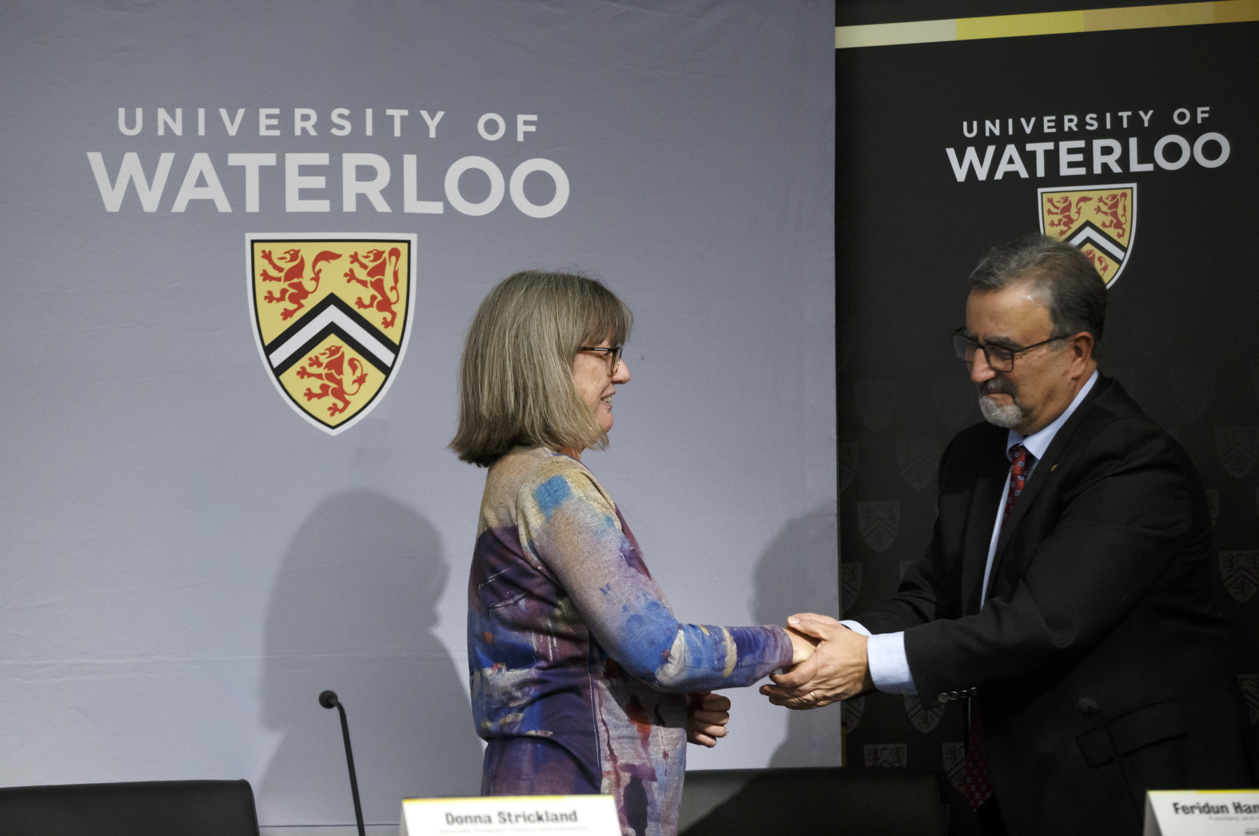 Professor Dr. Donna Strickland is congratulated by University of Waterloo president Feridun Hamdullahpur during a news conference at the University of Waterloo to field questions about her shared Nobel Prize in Physics, October 2, 2018 in Waterloo, Canada. Strickland won for her work on ultrashort lasers. The other two recipients were laser physicists Arthur Ashkin and Gérard Mourou. (Photo by Cole Burston/Getty Images)