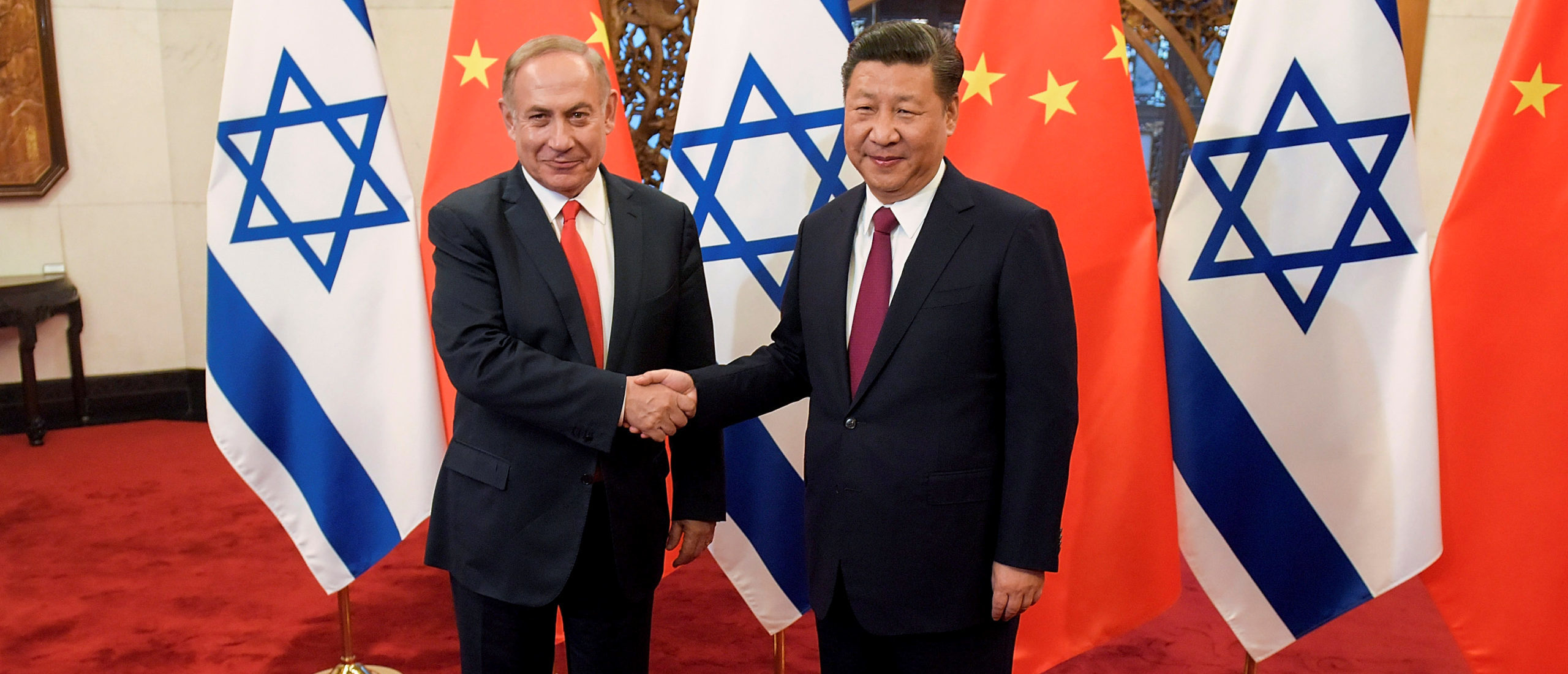 Chinese President Xi Jinping and former Israeli Prime Minister Benjamin Netanyahu met at Diaoyutai State Guesthouse in Beijing, China March 21, 2017. (REUTERS/Etienne Oliveau/Pool)