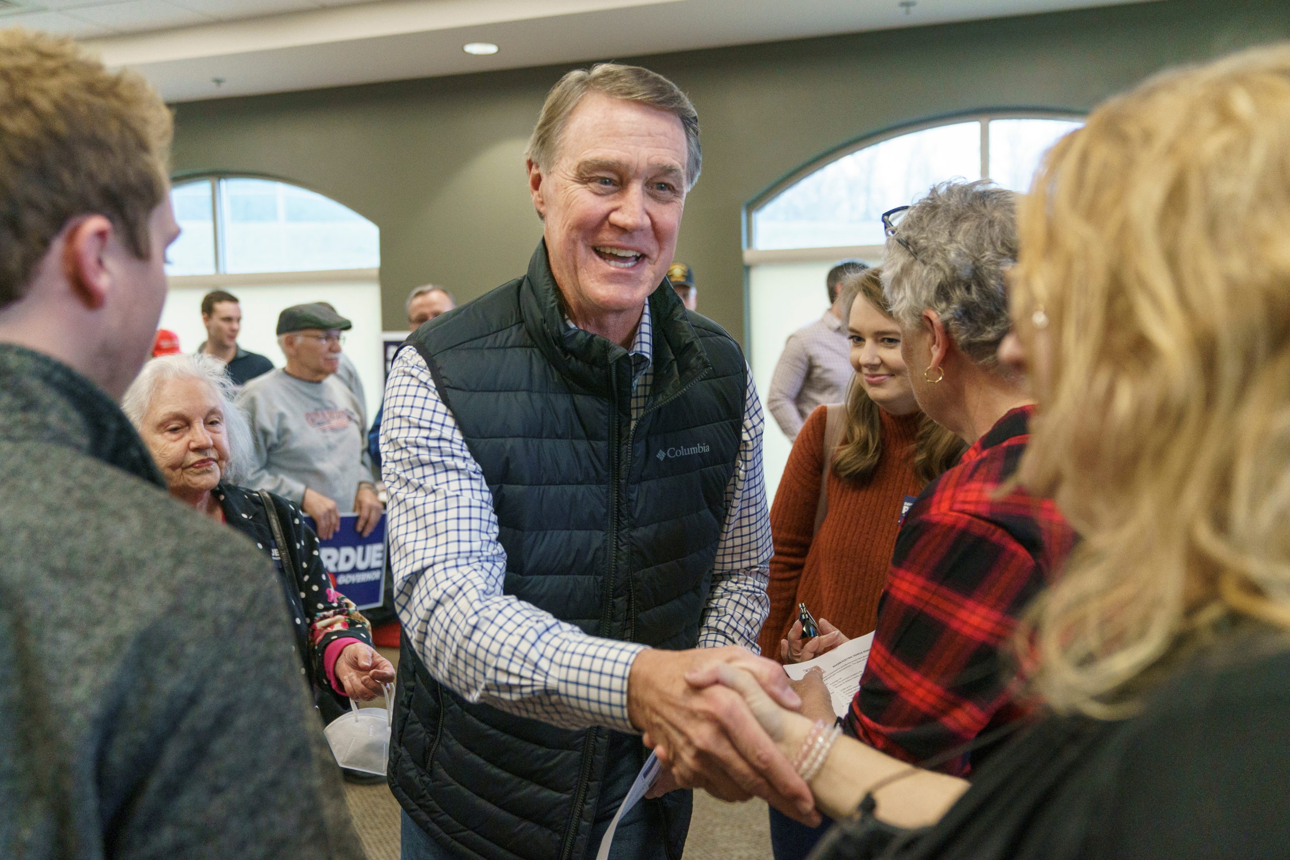 Former Republican U.S. Senator David Perdue, who is primarying incumbent Brian Kemp for Georgia governor, greets supporters following a campaign event in Covington, Georgia, U.S., February 2, 2022. REUTERS/Elijah Nouvelage
