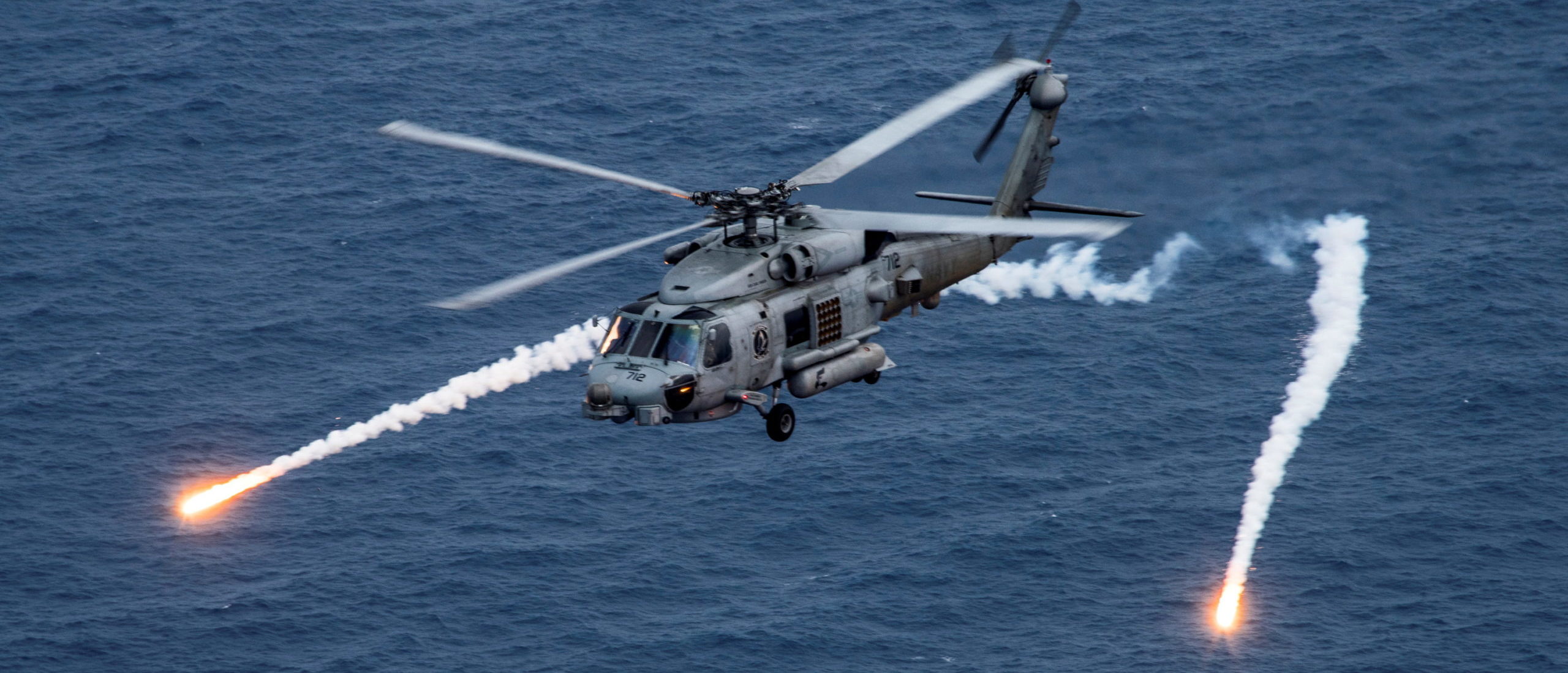 A U.S. Navy MH-60R Sea Hawk helicopter from the "Blue Hawks" of Helicopter Maritime Strike Squadron 78 fires chaff flares during a training exercise near the aircraft carrier USS Carl Vinson (CVN 70) in the Philippine Sea April 24, 2017. U.S. Navy/Mass Communication Specialist 2nd Class Sean M. Castellano/Handout via (REUTERS/File Photo)