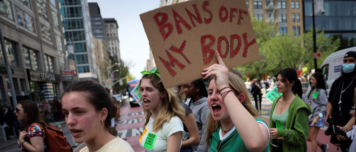 FILE PHOTO: Students and others protest for abortion rights as they march from Union Square, after the leak of a draft majority opinion written by Justice Samuel Alito preparing for a majority of the court to overturn the landmark Roe v. Wade abortion rights decision later this year, in Manhattan in New York City, New York, U.S., May 5, 2022. REUTERS/Mike Segar