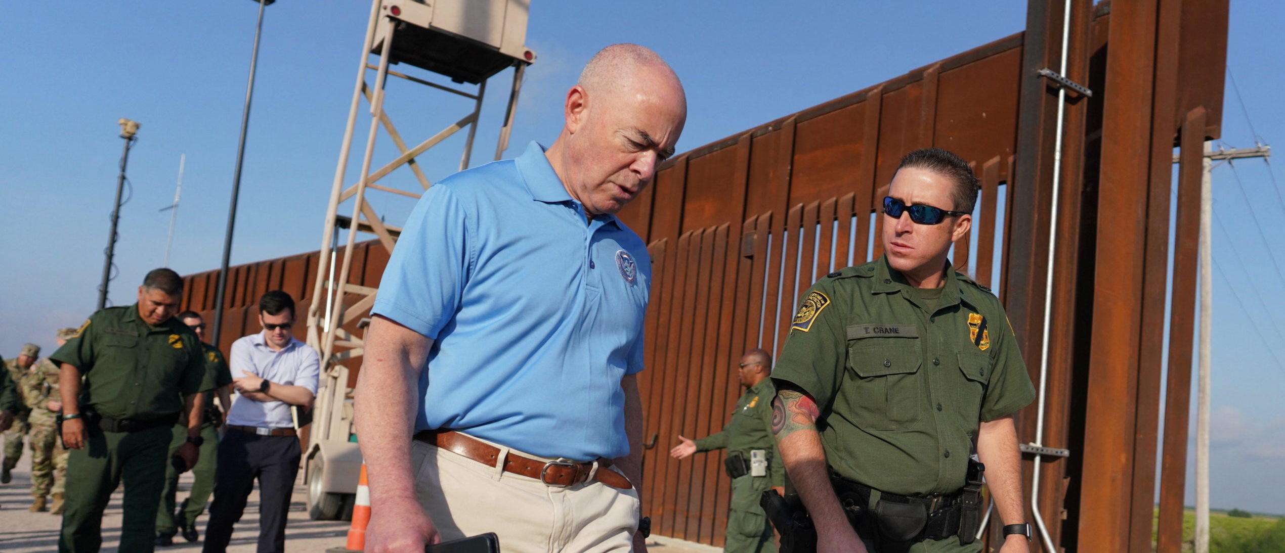 U.S. Homeland Security Secretary Alejandro Mayorka listens to deputy patrol agent in charge of the U.S. Border Patrol Anthony Crane as he tours the section of the border wall in Hidalgo, Texas, U.S. May 17, 2022. Joel Martinez/Pool via REUTERS