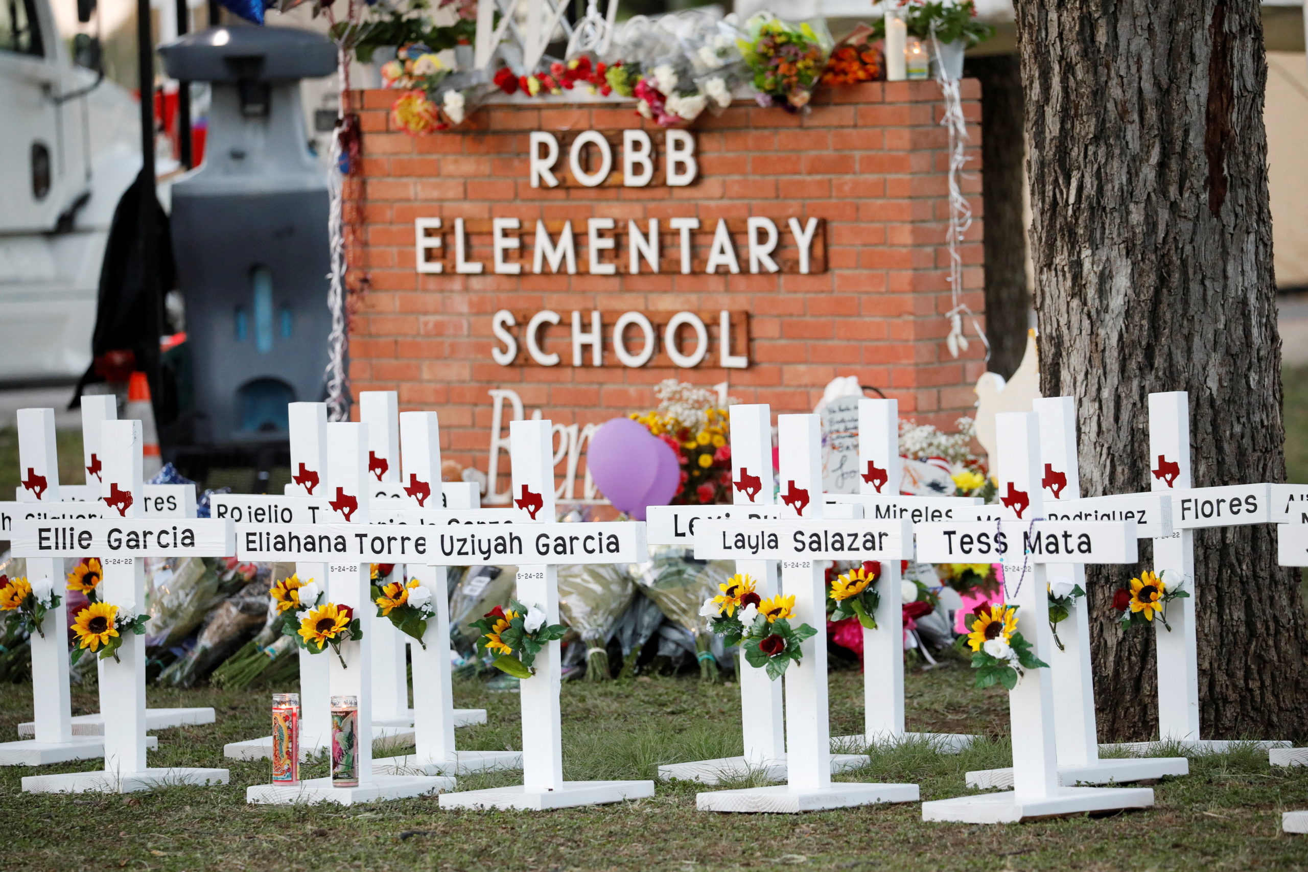 Crosses with the names of victims of a school shooting, are pictured at a memorial outside Robb Elementary school, after a gunman killed nineteen children and two teachers, in Uvalde, Texas, U.S. May 26, 2022. REUTERS/Marco Bello