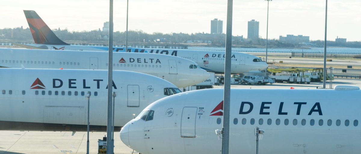 FILE PHOTO: Delta airplanes are seen at John F. Kennedy International Airport during the spread of the Omicron coronavirus variant in Queens, New York City, U.S., December 26, 2021. REUTERS/Jeenah Moon