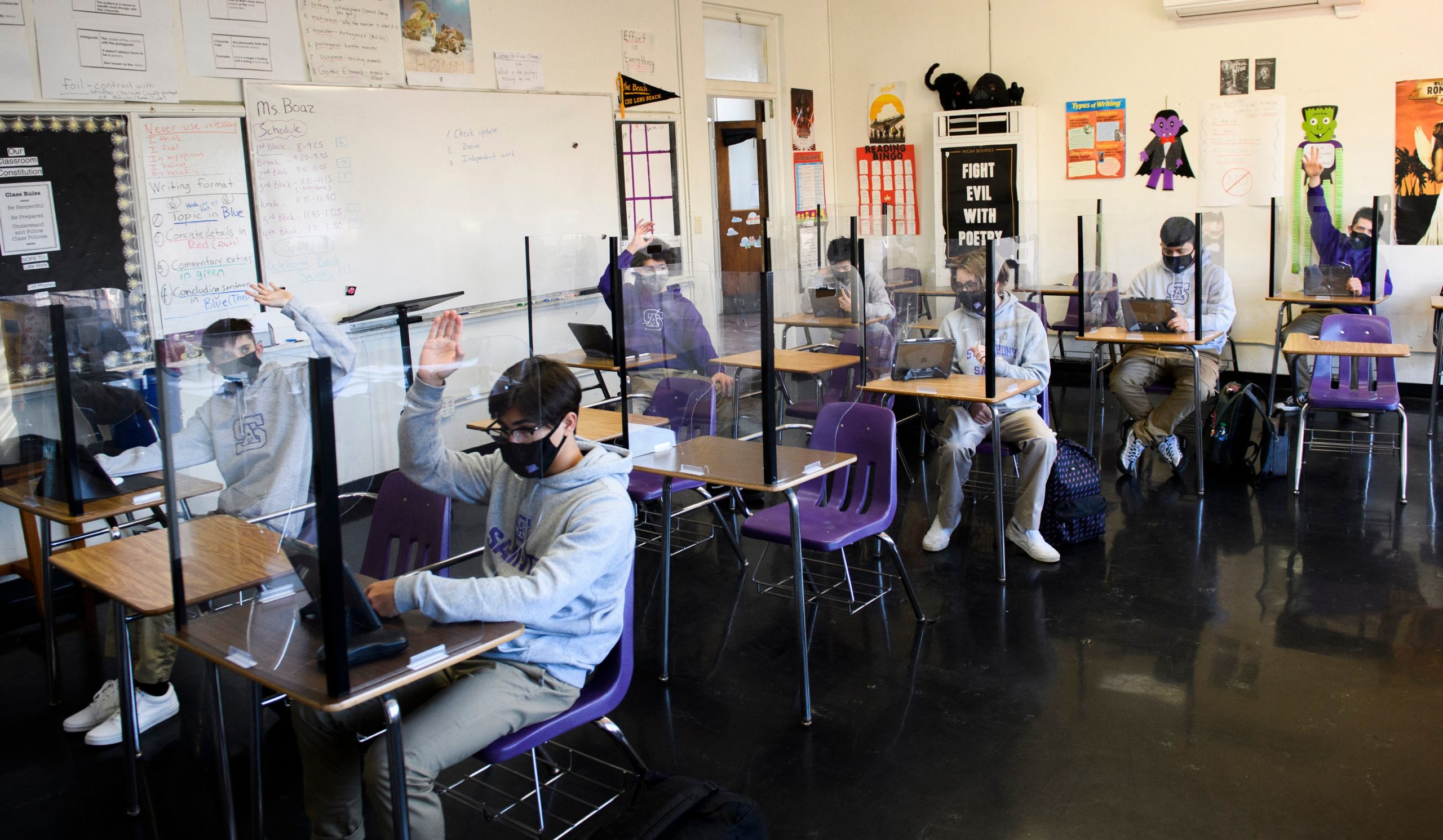 Students attend an in-person English class at St. Anthony Catholic High School during the Covid-19 pandemic on March 24, 2021 in Long Beach, California. (Photo by PATRICK T. FALLON/AFP via Getty Images)