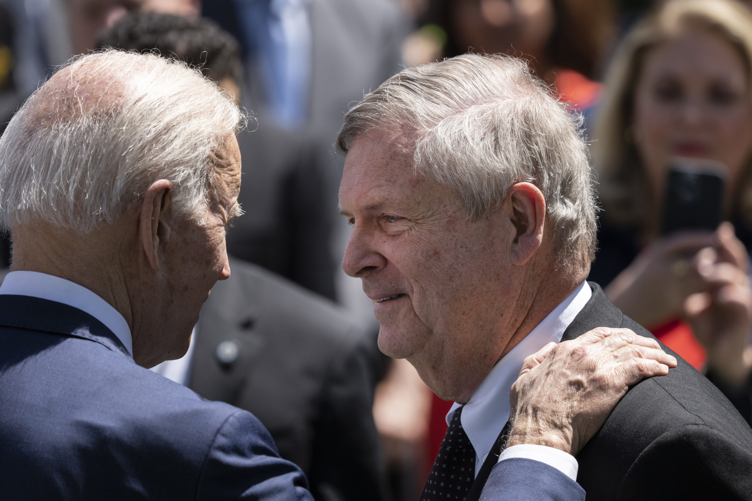 President Joe Biden greets Secretary of Agriculture Tom Vilsack at an event on May 9. (Drew Angerer/Getty Images)