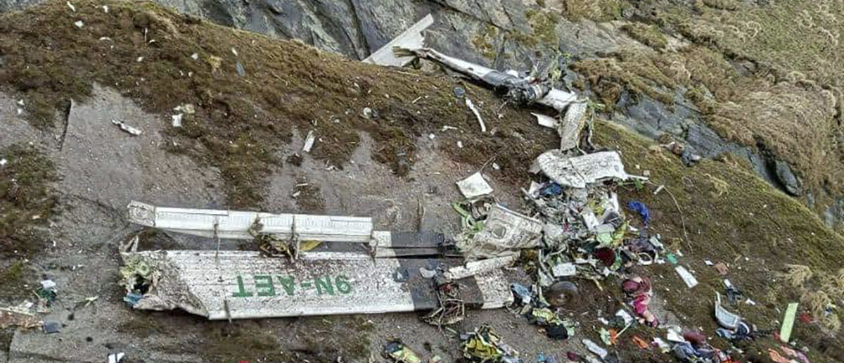 Officials Search Through Rubble For Bodies After Plane Carrying 22 People Crashes Into Mountains