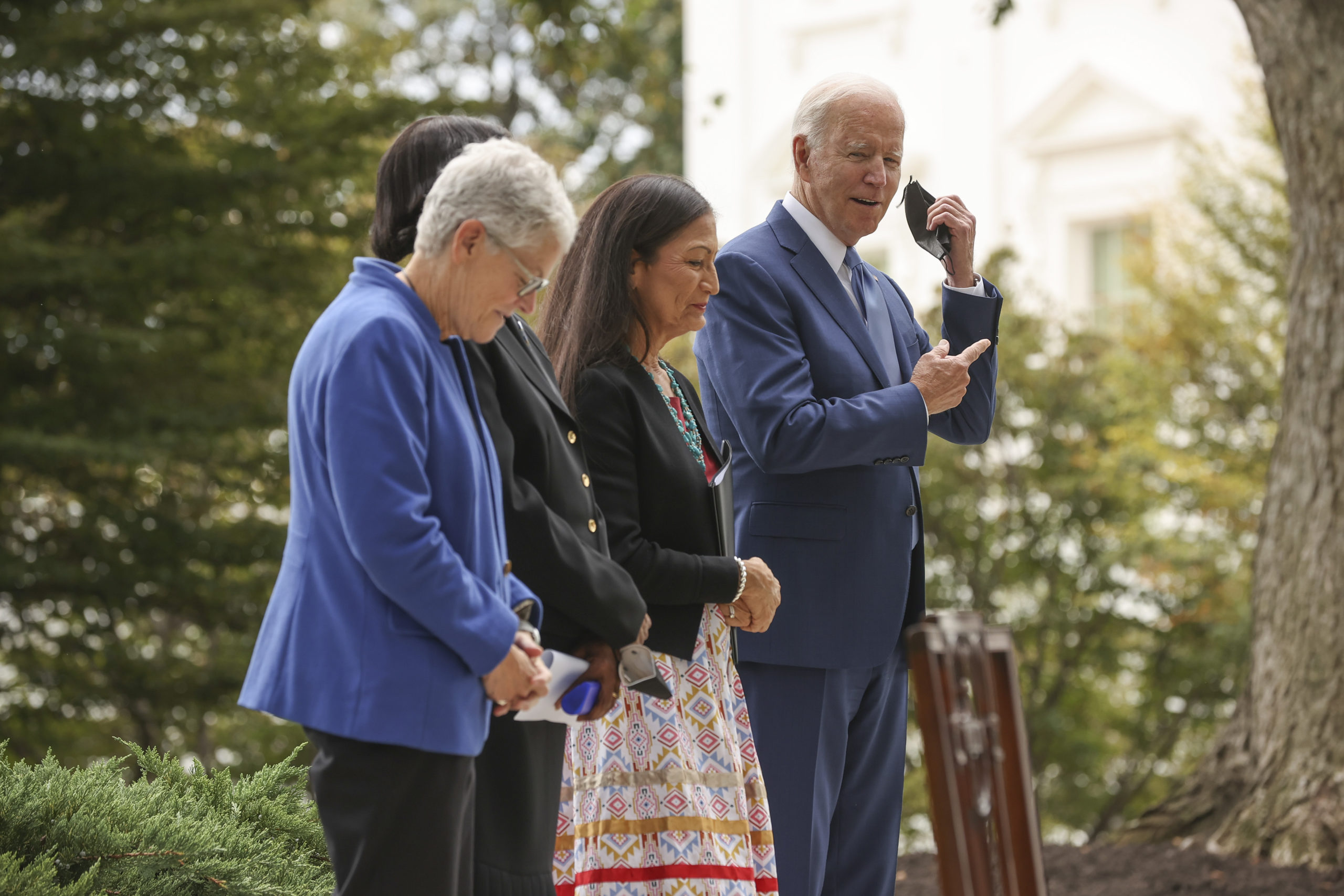 President Joe Biden stands with Gina McCarthy and Interior Secretary Deb Haaland on Oct. 8. (Chip Somodevilla/Getty Images)