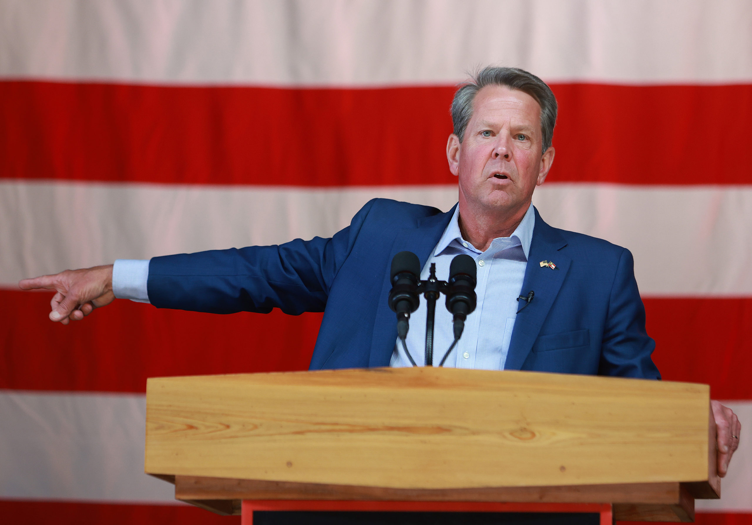 Georgia Gov. Brian Kemp speaks at a campaign event attended by former U.S. Vice President Mike Pence at the Cobb County International Airport on May 23, 2022 in Kennesaw, Georgia. (Photo by Joe Raedle/Getty Images)