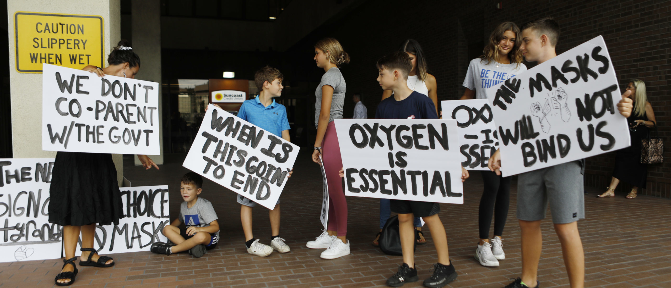 Families protest any potential mask mandates before the Hillsborough County Schools Board meeting held at the district office on July 27, 2021 in Tampa, Florida. (Photo by Octavio Jones/Getty Images)