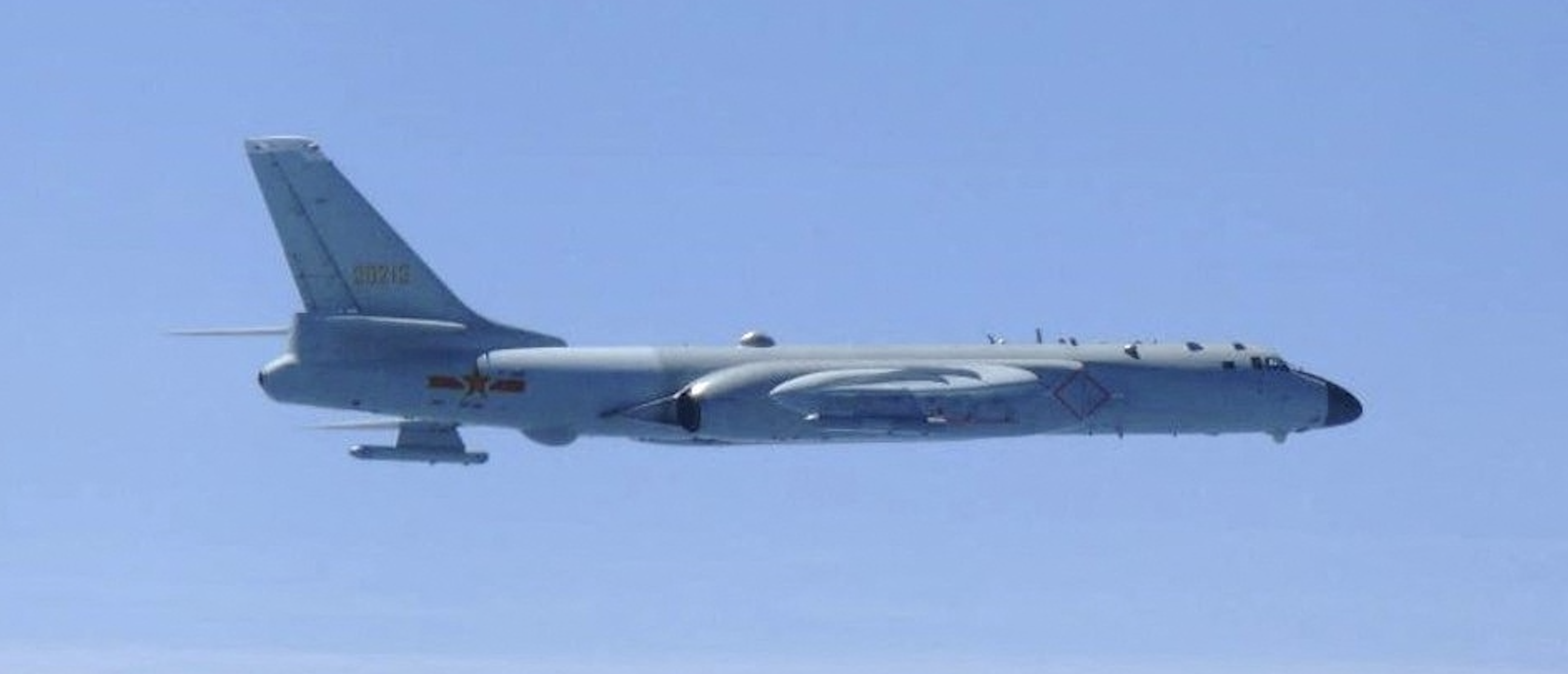 A Chinese H-6 bomber flies over East China Sea in this handout picture taken by Japan Air Self-Defence Force and released by the Joint Staff Office of the Defense Ministry of Japan May 24, 2022. (Joint Staff Office of the Defense Ministry of Japan/HANDOUT via REUTERS)