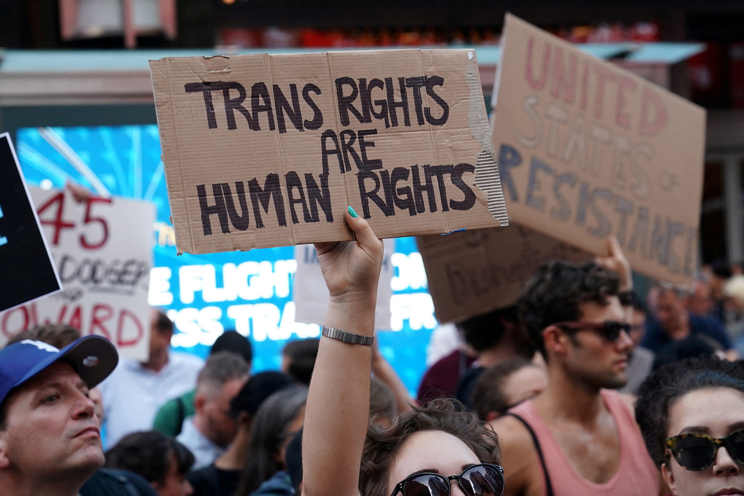 FILE PHOTO: People protest U.S. President Donald Trump's announcement that he plans to reinstate a ban on transgender individuals from serving in any capacity in the U.S. military, in Times Square, in New York City, New York, U.S., July 26, 2017. REUTERS/Carlo Allegri/File Photo