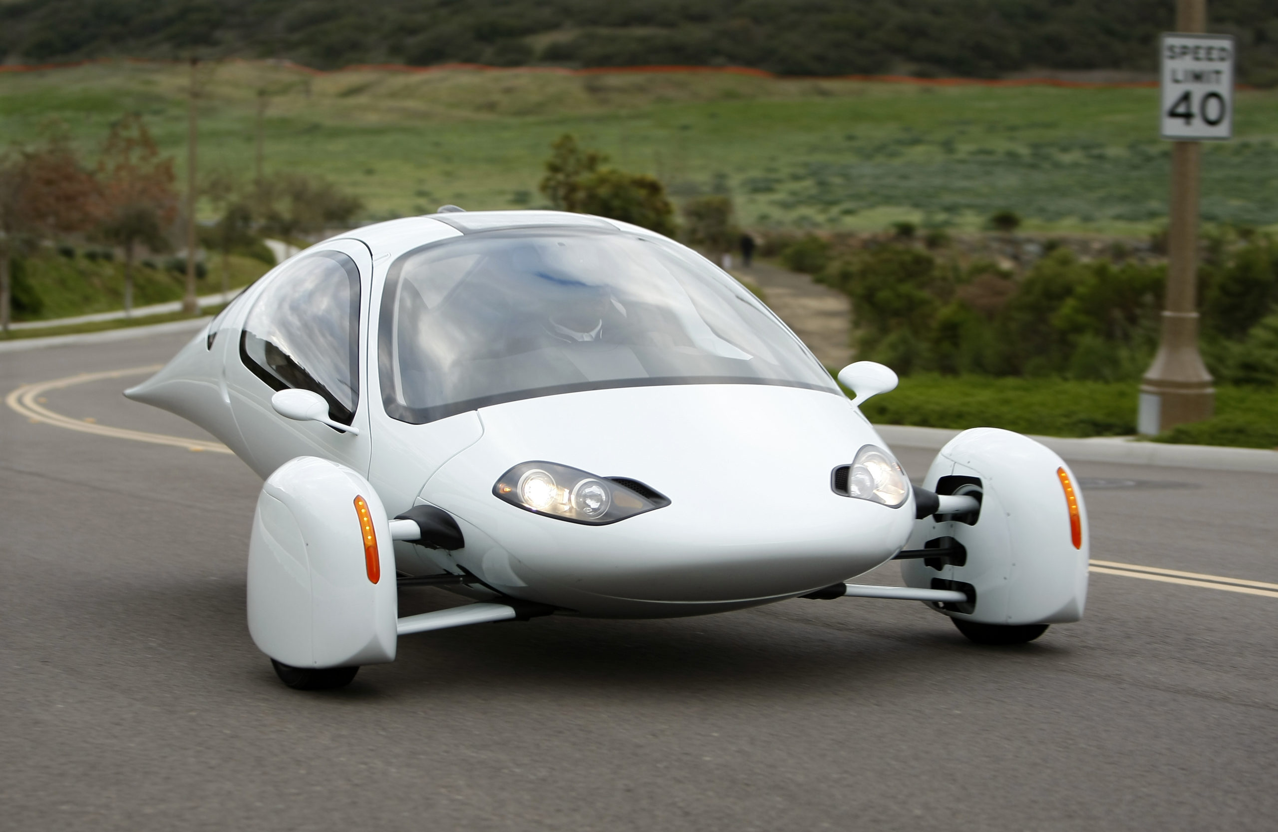 The Aptera 2e electric vehicle is driven down a road in Carlsbad, California February 13, 2009. The Aptera is an egg-shaped two-seater often likened to a space-age car from the futuristic 1960s cartoon "The Jetsons." Looking more like an aircraft than a road vehicle, it is a far cry from the hybrid sedans and electric sports cars being produced by conventional automakers. To the executives behind the vehicle, its aerodynamic design and 100 miles per gallon (42 km per litre) range points the way to the future. Picture taken February 13, 2009. To match feature APTERA/ REUTERS/Mike Blake (UNITED STATES)