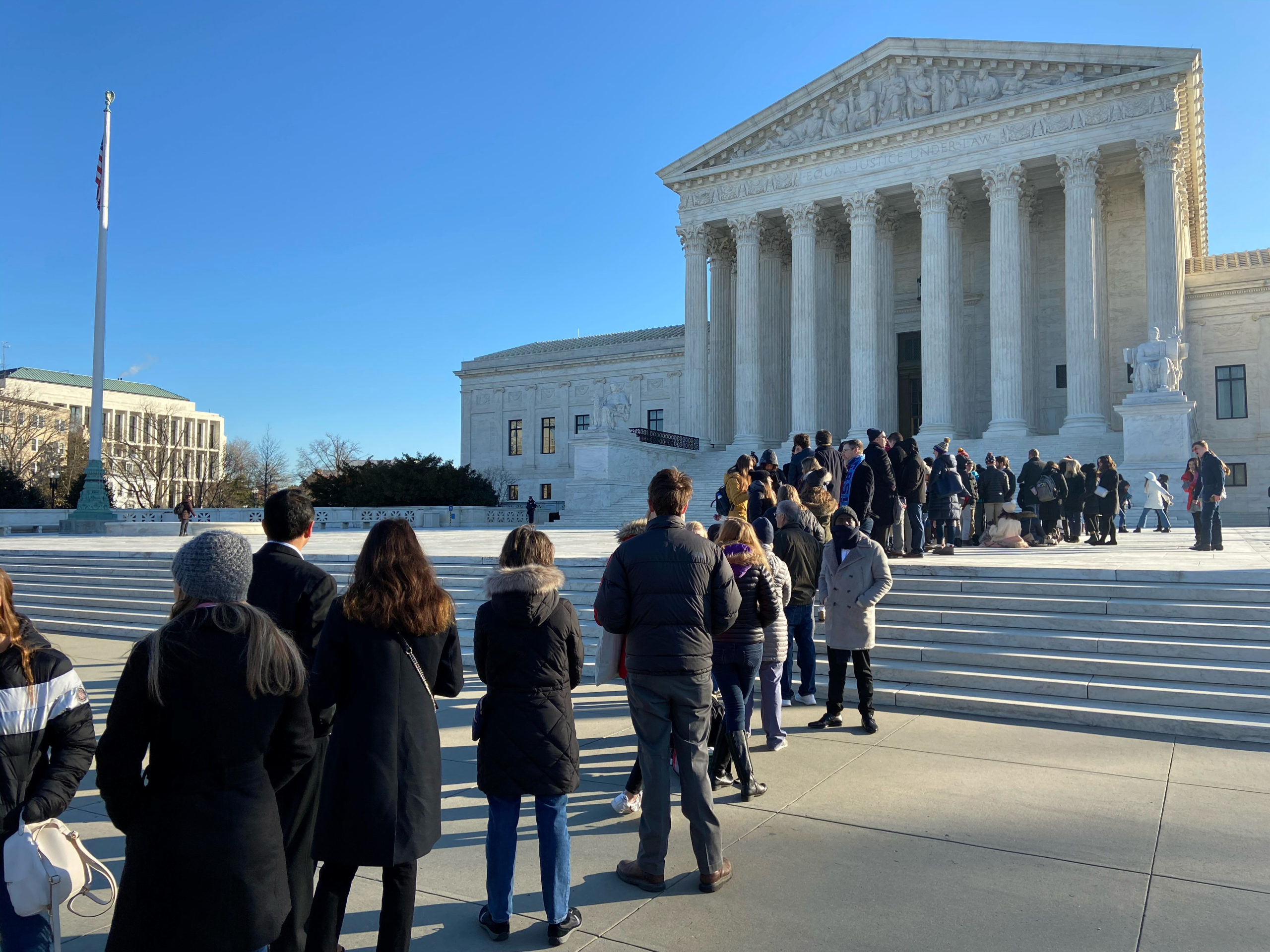 People line up outside the Supreme Court ahead of oral arguments in a case from Montana on religious rights and school choice, in Washington, U.S. January 22, 2020. REUTERS/Lawrence Hurley