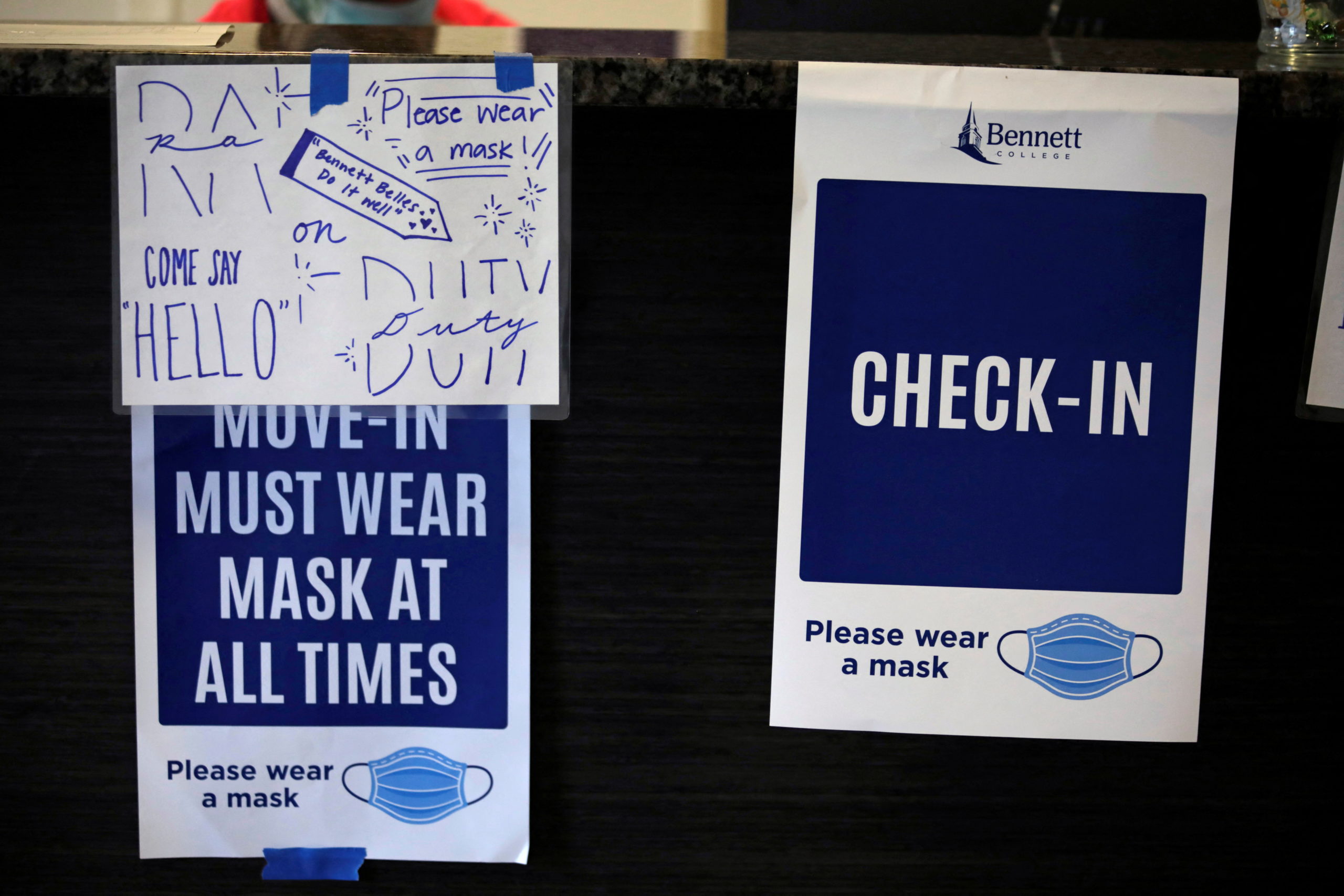 Signs reminding students to wear their masks are seen during move in day as Bennett College students return to campus for the first time since the HBCU Liberal Arts College went remote to prevent the spread of the coronavirus disease (COVID-19) in March 2020, in Greensboro, North Carolina, U.S., August 30, 2021. REUTERS/Gabrielle Crockett