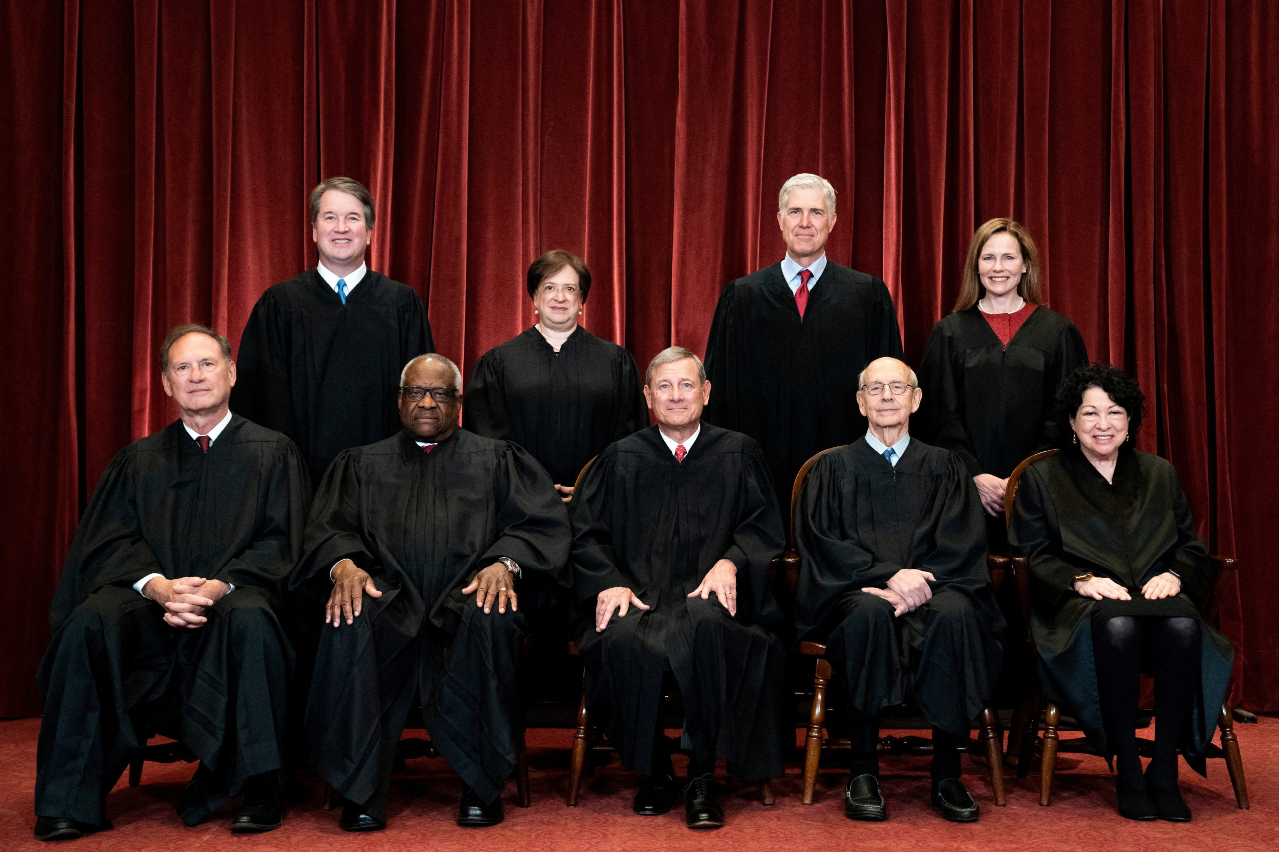 FILE PHOTO: Associate Justice Brett Kavanaugh, Associate Justice Elena Kagan, Associate Justice Neil Gorsuch, Associate Justice Amy Coney Barrett, Associate Justice Samuel Alito, Associate Justice Clarence Thomas, Chief Justice John Roberts, Associate Justice Stephen Breyer and Associate Justice Sonia Sotomayor pose for a group photo at the Supreme Court in Washington, U.S., April 23, 2021. Erin Schaff/Pool via REUTERS/File Photo