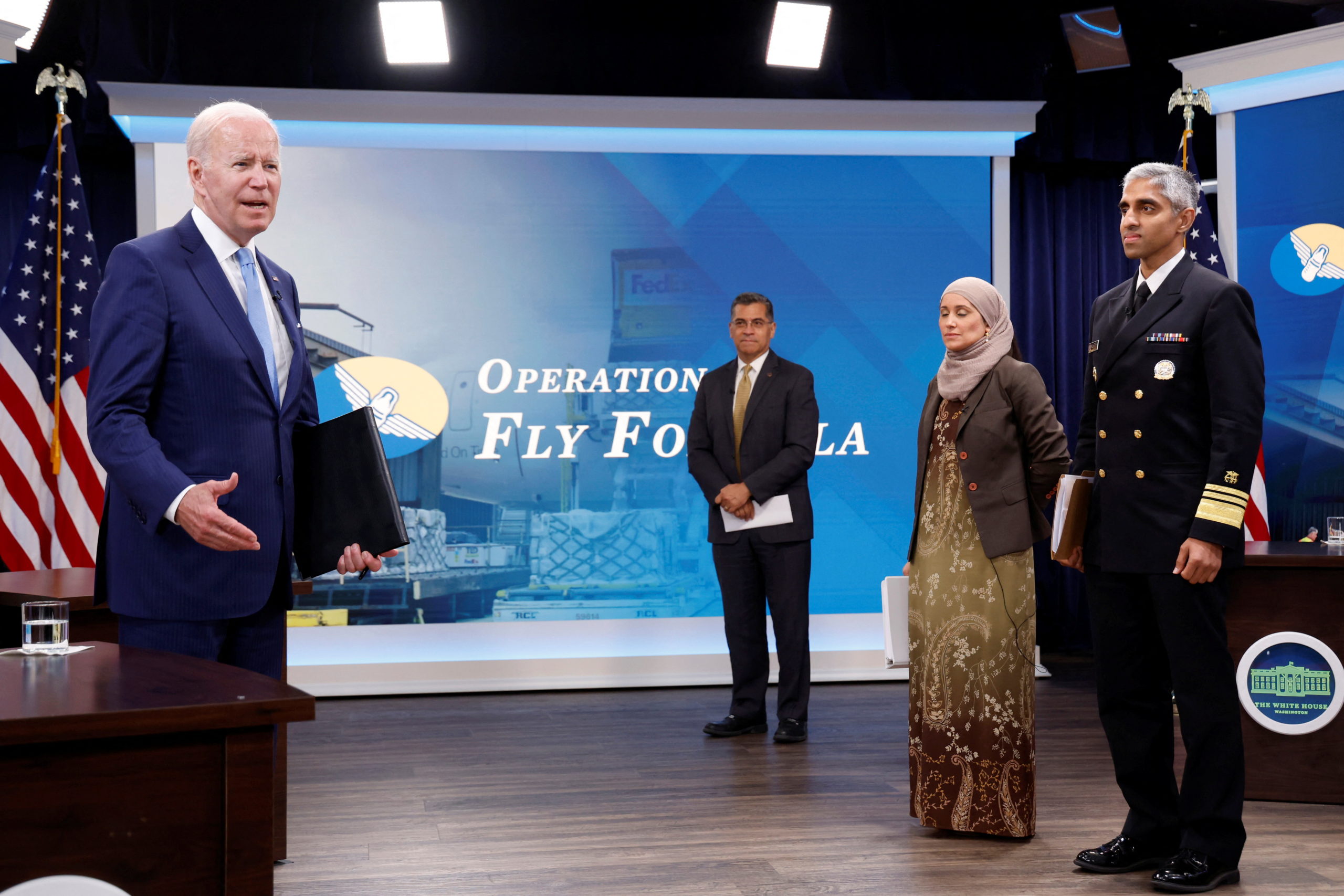 U.S. President Joe Biden, flanked by Secretary Xavier Becerra from U.S. Department of Health and Human Services, Surgeon General Vivek Murthy and Sameera Fazili, Deputy Assistant to the President and Deputy Director of the National Economic Council, speaks to journalists following holding a meeting with White House officials and baby formula manufacturers, as part of the U.S. response to the ongoing baby formula shortage, in an auditorium on the White House campus in Washington, U.S. June 1, 2022. REUTERS/Jonathan Ernst