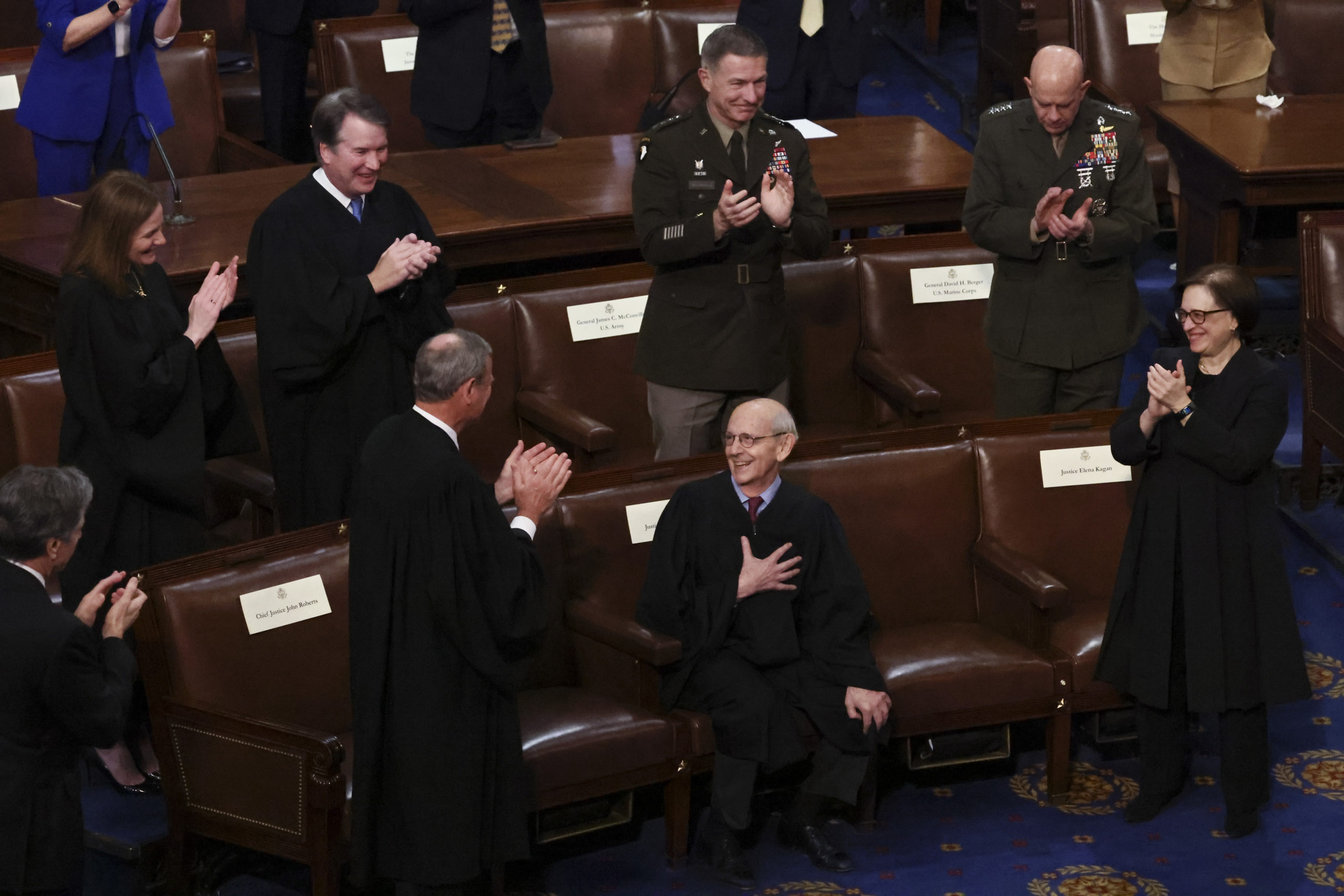 WASHINGTON, DC - MARCH 01: U.S. Supreme Court Chief Justice John Roberts and Associate Justices Amy Coney Barrett, Brett Kavanaugh and Elena Kagan as well as U.S. Army Chief of Staff General James McConville and U.S. Marines Chief of Staff General David Berger applaud retiring Supreme Court Justice Stephen Breyer as Breyer is honored by U.S. President Joe Biden as Biden delivers the State of the Union address during a joint session of Congress in the U.S. Capitol’s House Chamber March 01, 2022 in Washington, DC. During his first State of the Union address Biden spoke on his administration’s efforts to lead a global response to the Russian invasion of Ukraine, efforts to curb inflation and bringing the country out of the COVID-19 pandemic. (Photo by Evelyn Hockstein-Pool/Getty Images)