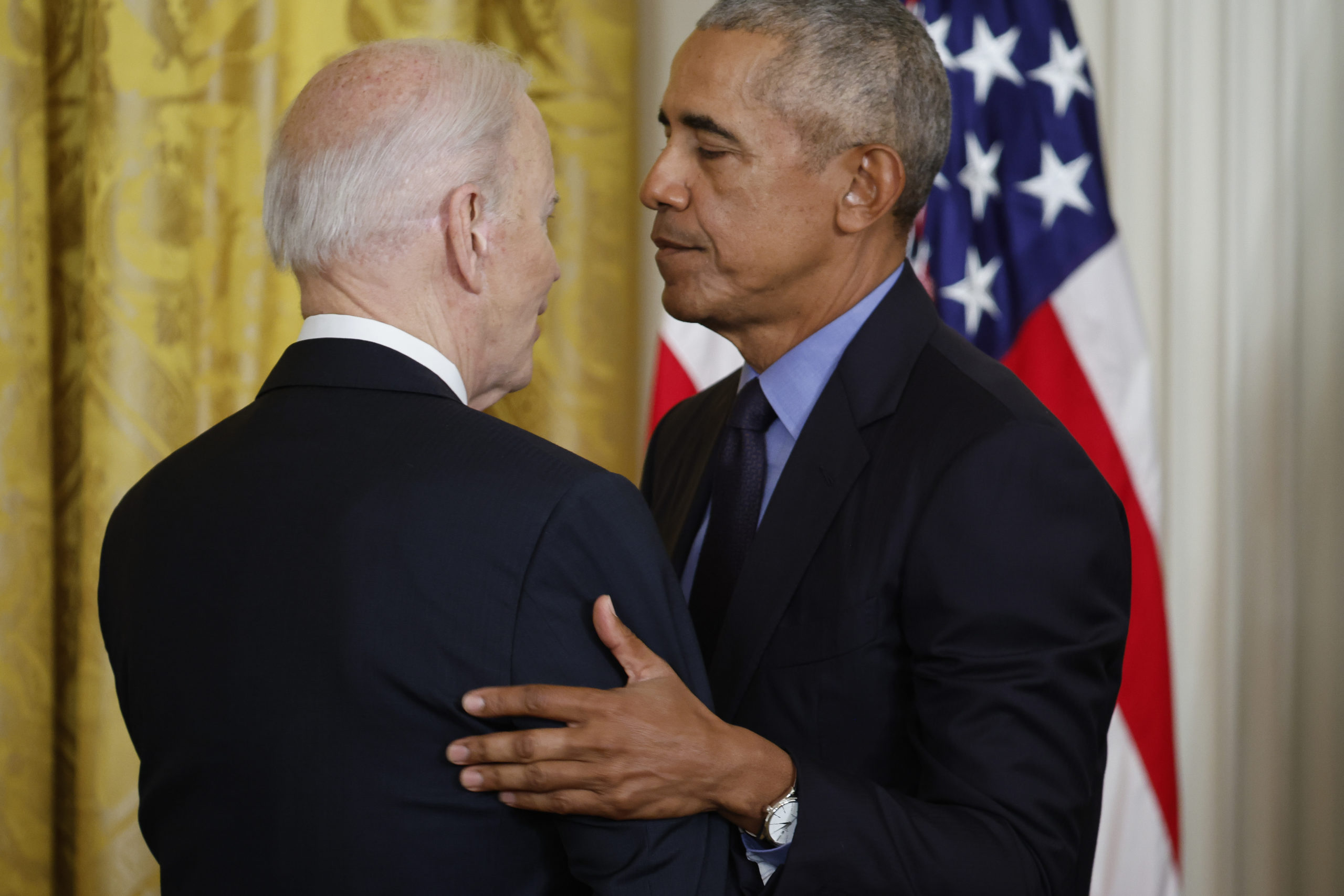 U.S. President Joe Biden and former President Barack Obama embrace during an event to mark the 2010 passage of the Affordable Care Act in the East Room of the White House on April 5, 2022 in Washington, DC. With then-Vice President Joe Biden by his side, Obama signed 'Obamacare' into law on March 23, 2010. (Photo by Chip Somodevilla/Getty Images)