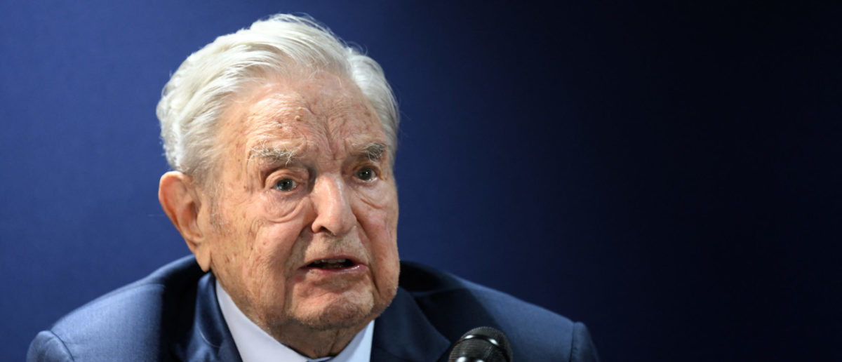 Hungarian-born US investor and philanthropist George Soros answers to questions after delivering a speech on the sidelines of the World Economic Forum (WEF) annual meeting in Davos on May 24, 2022. (Photo by Fabrice COFFRINI / AFP) 