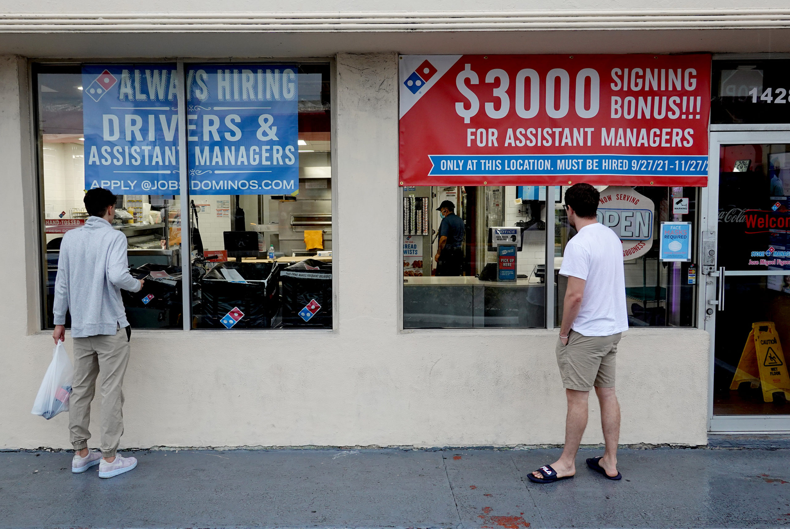A Dominos restaurant posts signs advertising job openings in Miami Beach, Florida. (Joe Raedle/Getty Images)