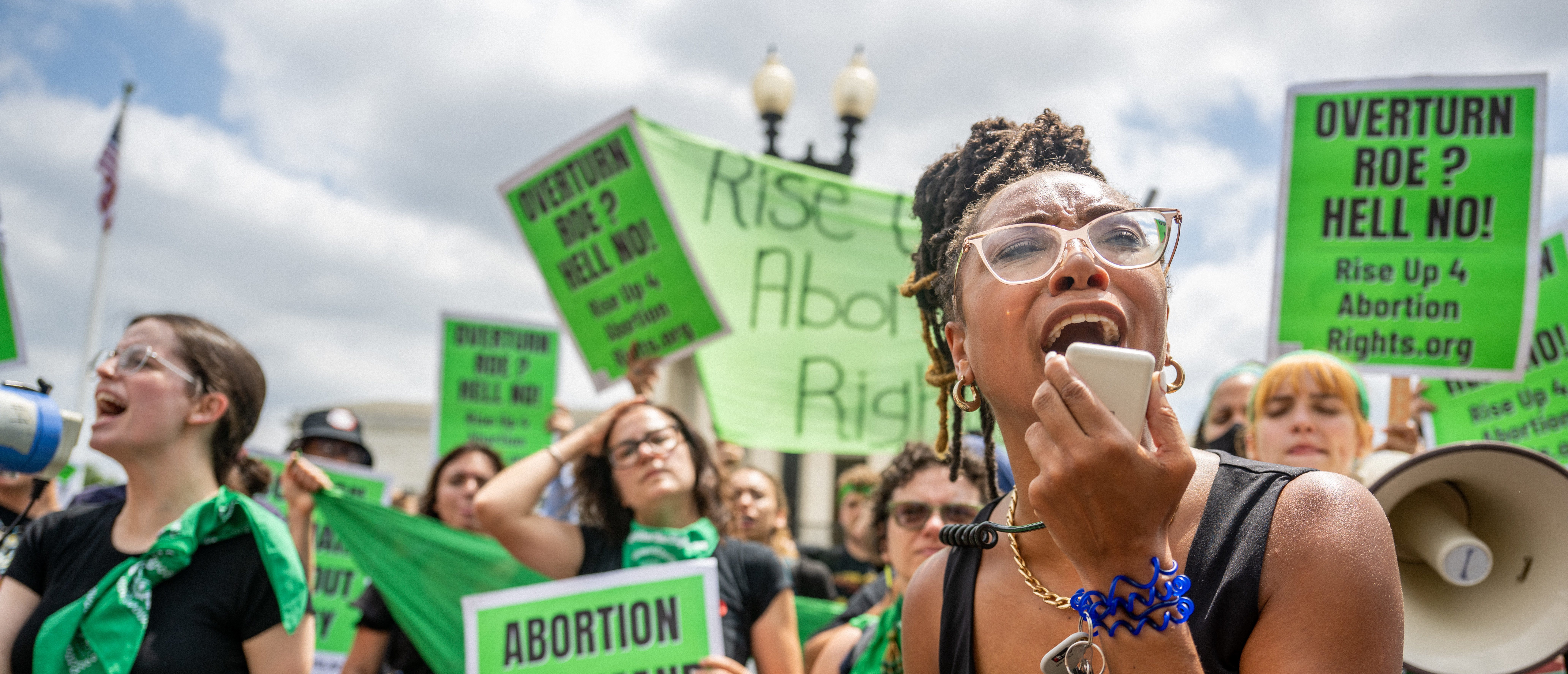 WASHINGTON, DC - JUNE 24: Abortion rights demonstrator Elizabeth White leads a chant in response to the Dobbs v Jackson Women's Health Organization ruling in front of the U.S. Supreme Court on June 24, 2022 in Washington, DC.