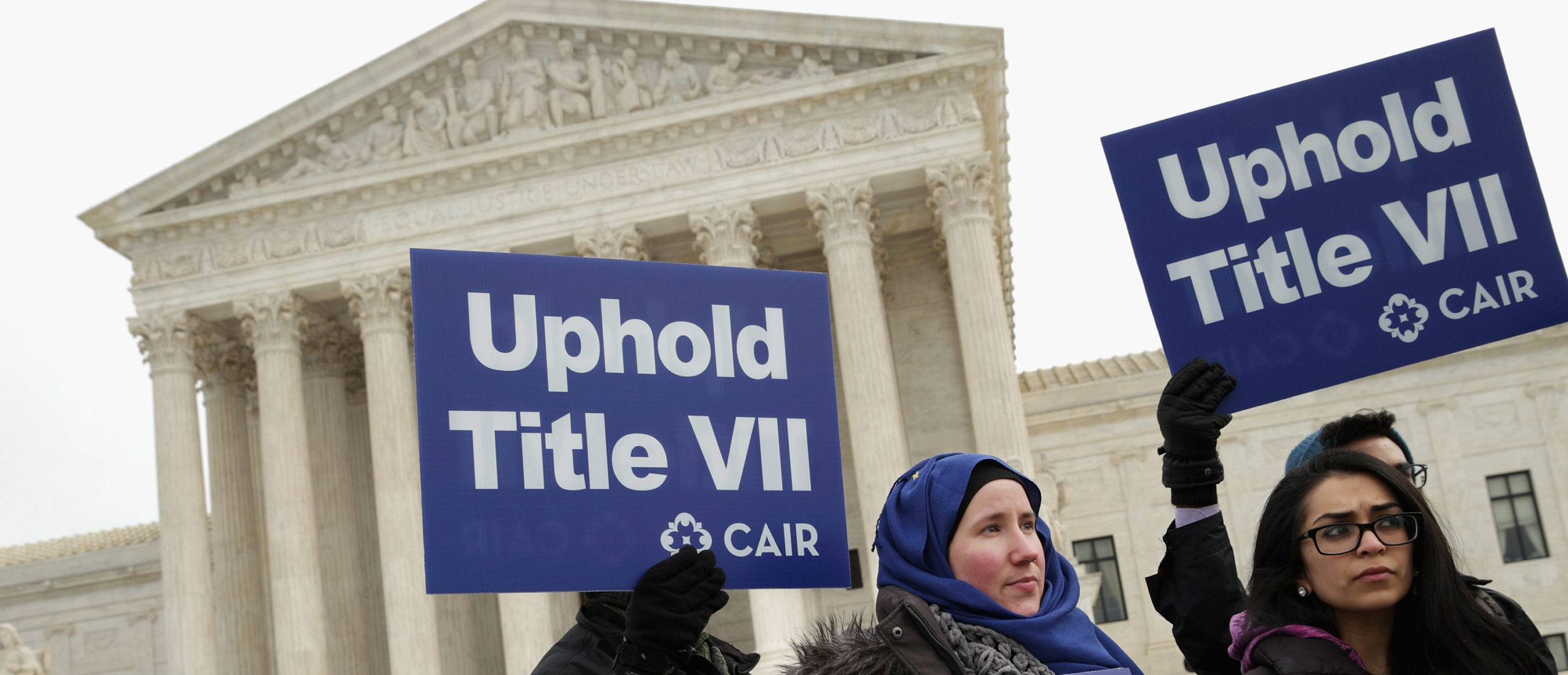 WASHINGTON, DC - FEBRUARY 25: Lauren Schreiber (L) and Umna Khan join other supporters from The Council on American-Islamic Relations during a news conference outside the U.S. Supreme Court after the court heard oral arguments in EEOC v. Abercrombie & Fitch February 25, 2015 in Washington, DC. Samantha Elauf of Tulsa, Oklahoma, filed a charge of religious discrimination with the Equal Employment Opportunity Commission saying Abercrombie & Fitch violated discrimination laws in 2008 by declining to hire her because she wore a head scarf, a symbol of her Muslim faith. (Photo by Chip Somodevilla/Getty Images)