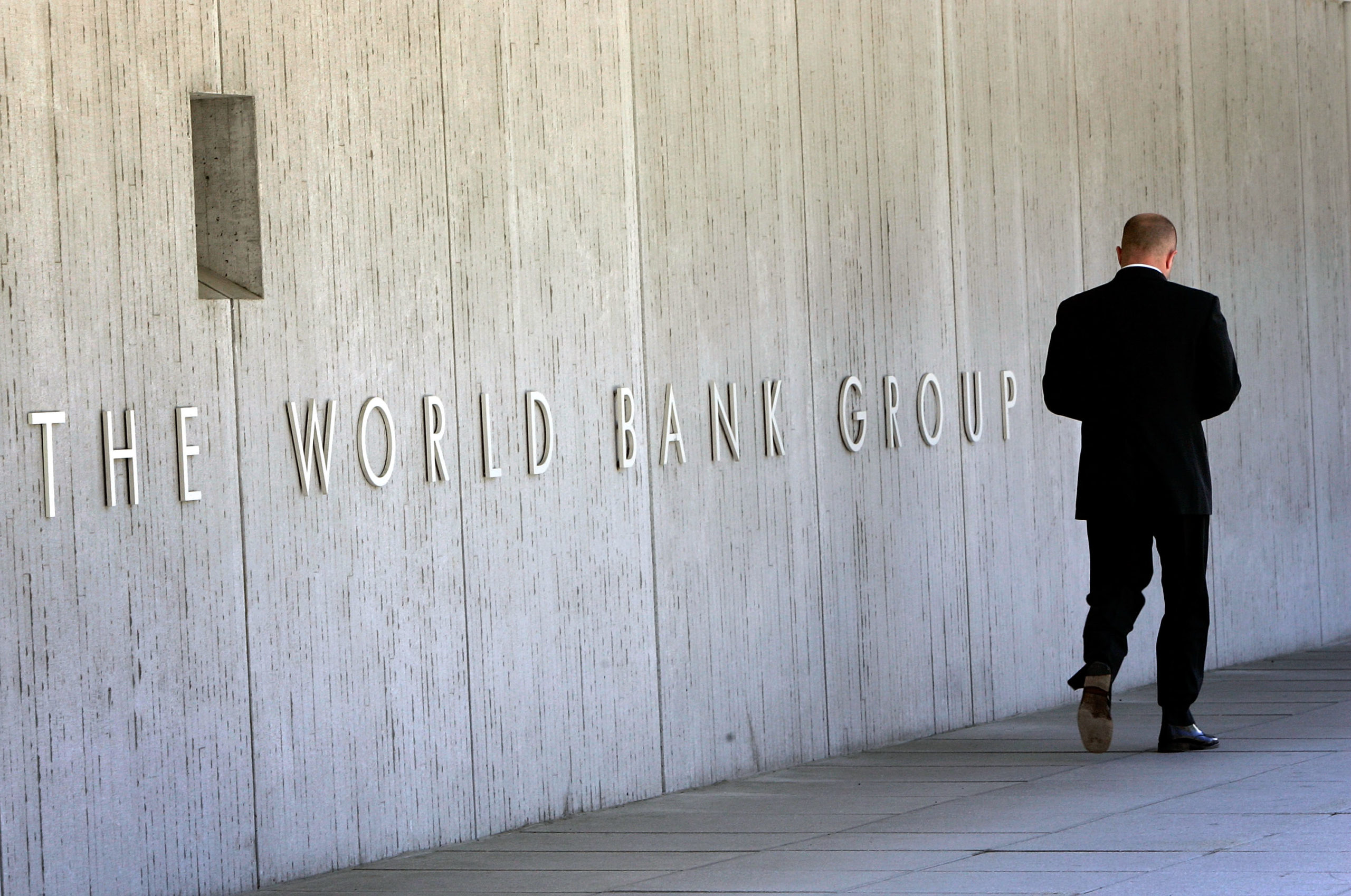 An employee walks outside the World Bank headquarters in Washington, D.C. (Win McNamee/Getty Images)