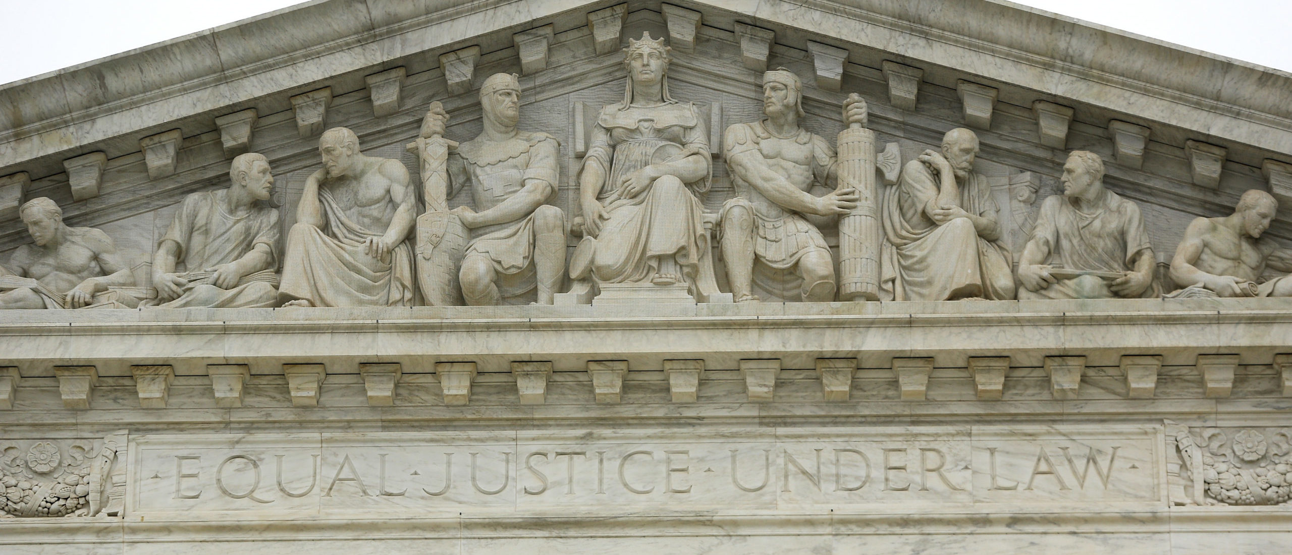 The phrase "Equal Justice Under Law" adorns the west entrance to the U.S. Supreme Court building in Washington December 3, 2014. Picture taken December 3, 2014. To match Special Report SCOTUS-ELITES/ REUTERS/Jonathan Ernst (UNITED STATES - Tags: POLITICS LAW BUSINESS)